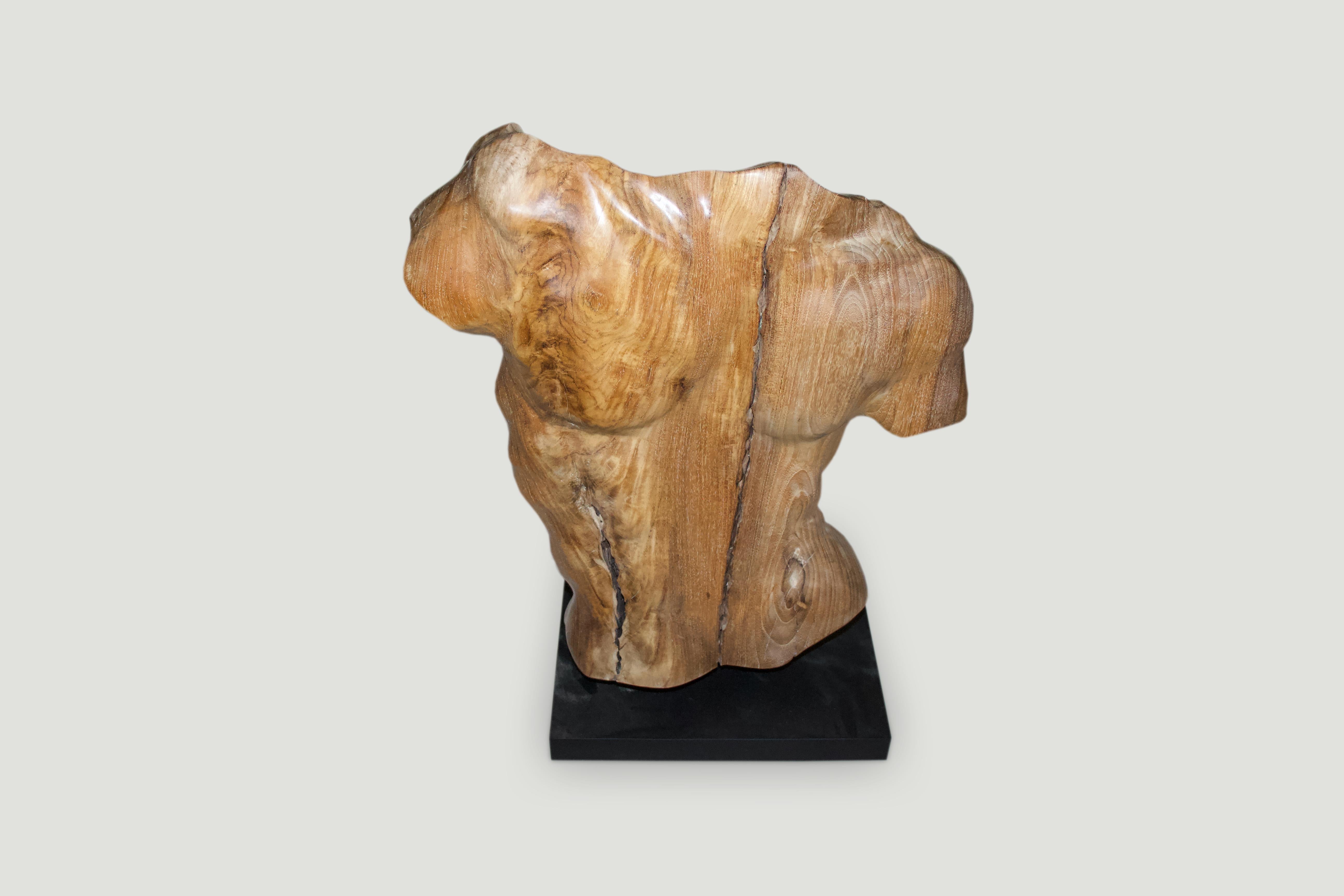 Hand carved from a single reclaimed teak wood root with natural oil finish, a male torso. Shown on a black metal base.

Own an Andrianna Shamaris original.

Andrianna Shamaris. The Leader In Modern Organic Design.