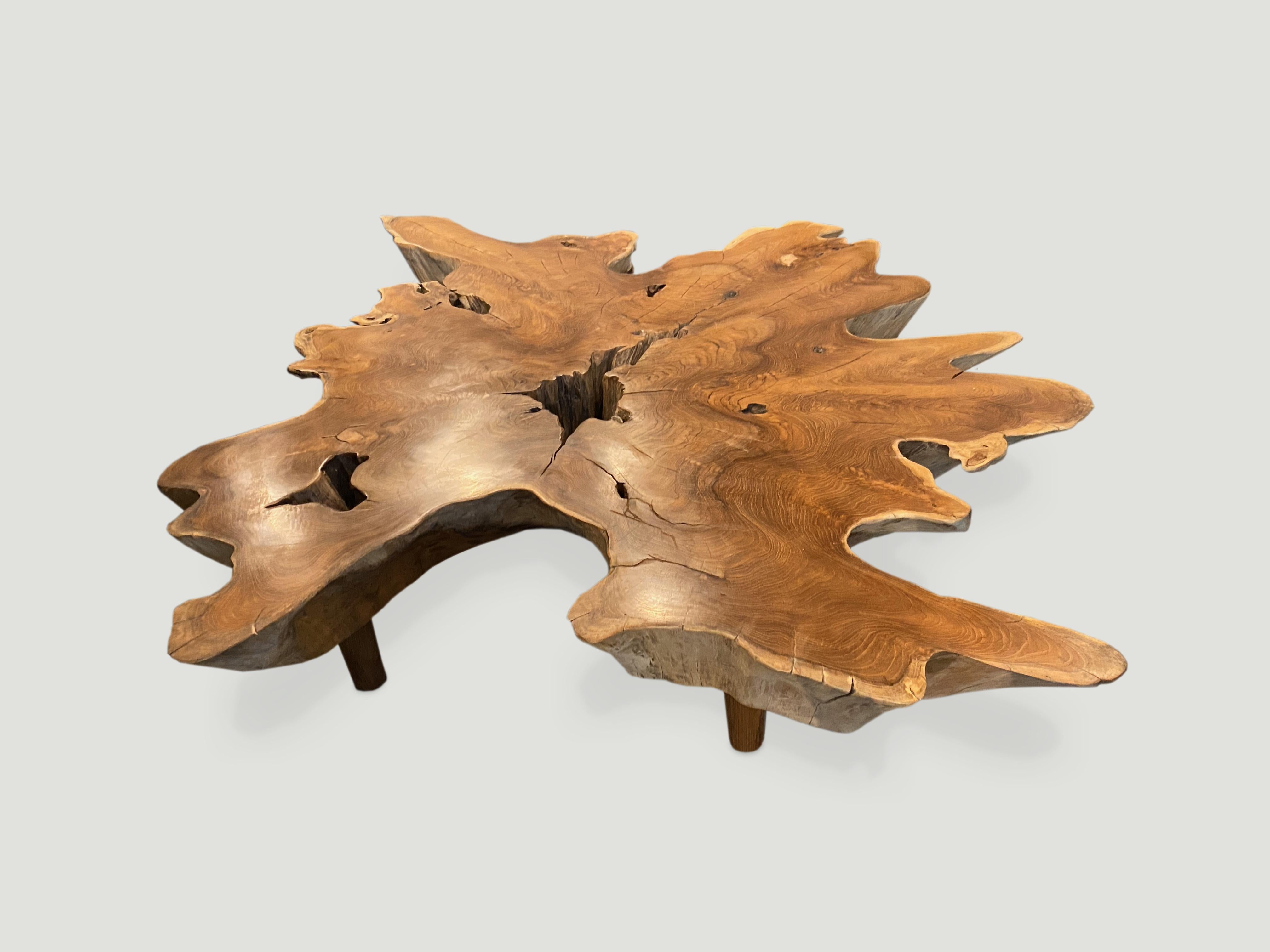 Impressive seven inch reclaimed teak coffee table with a polished top and the sides left natural in contrast. Floating on midcentury style legs. Organic with a twist.

Andrianna Shamaris. The Leader In Modern Organic Design.