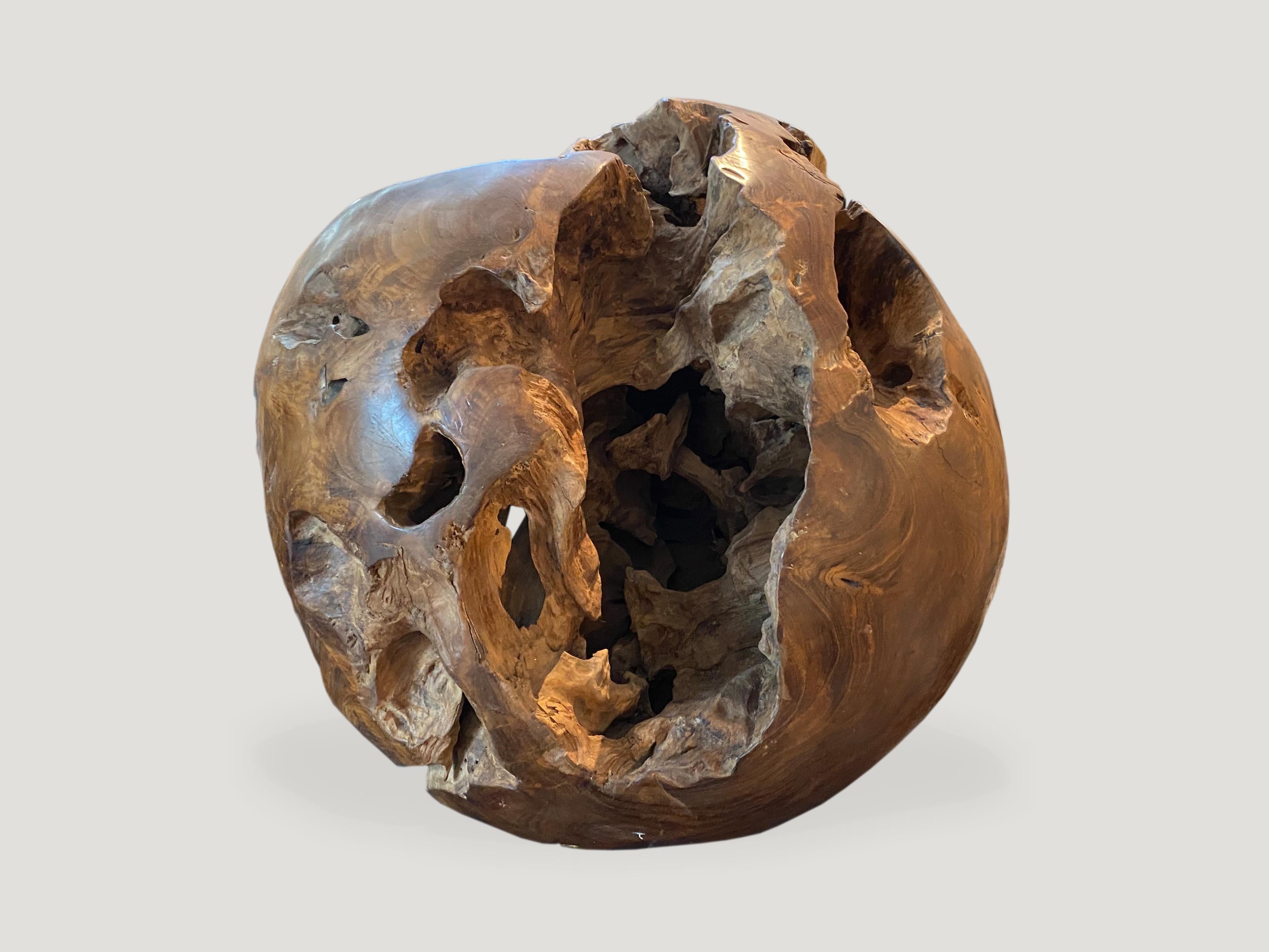 Impressive organic teak wood root shaped into a sphere. Polished on the outside while the inner sections are left raw. A unique sculpture standing alone or in a group setting. Organic is the new modern.

This sculpture was made in the spirit of