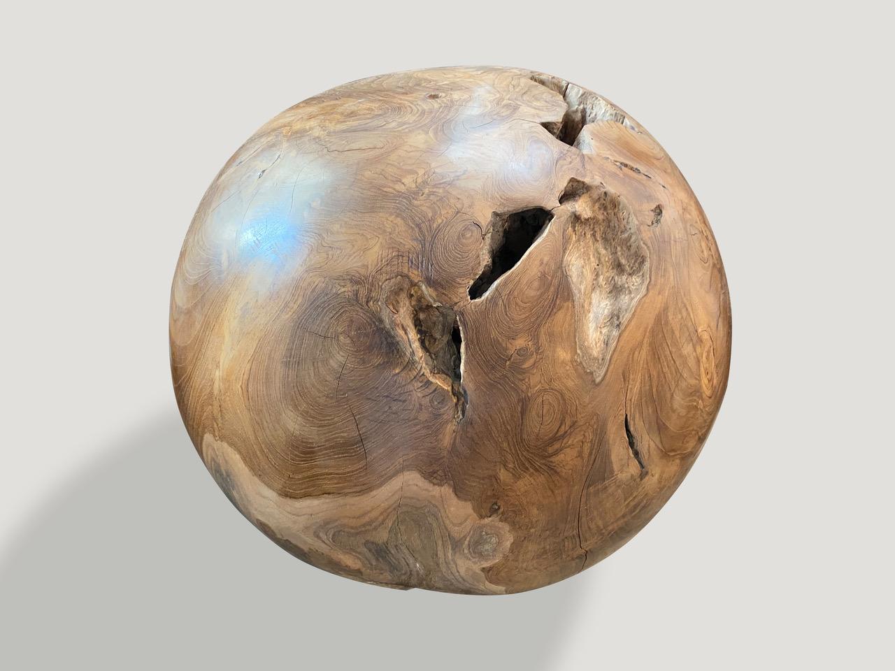 Natural teak wood root sphere. The outer section is polished and the inner root left smooth in contrast. We have a collection available. The price reflects the one shown. Measures: 18