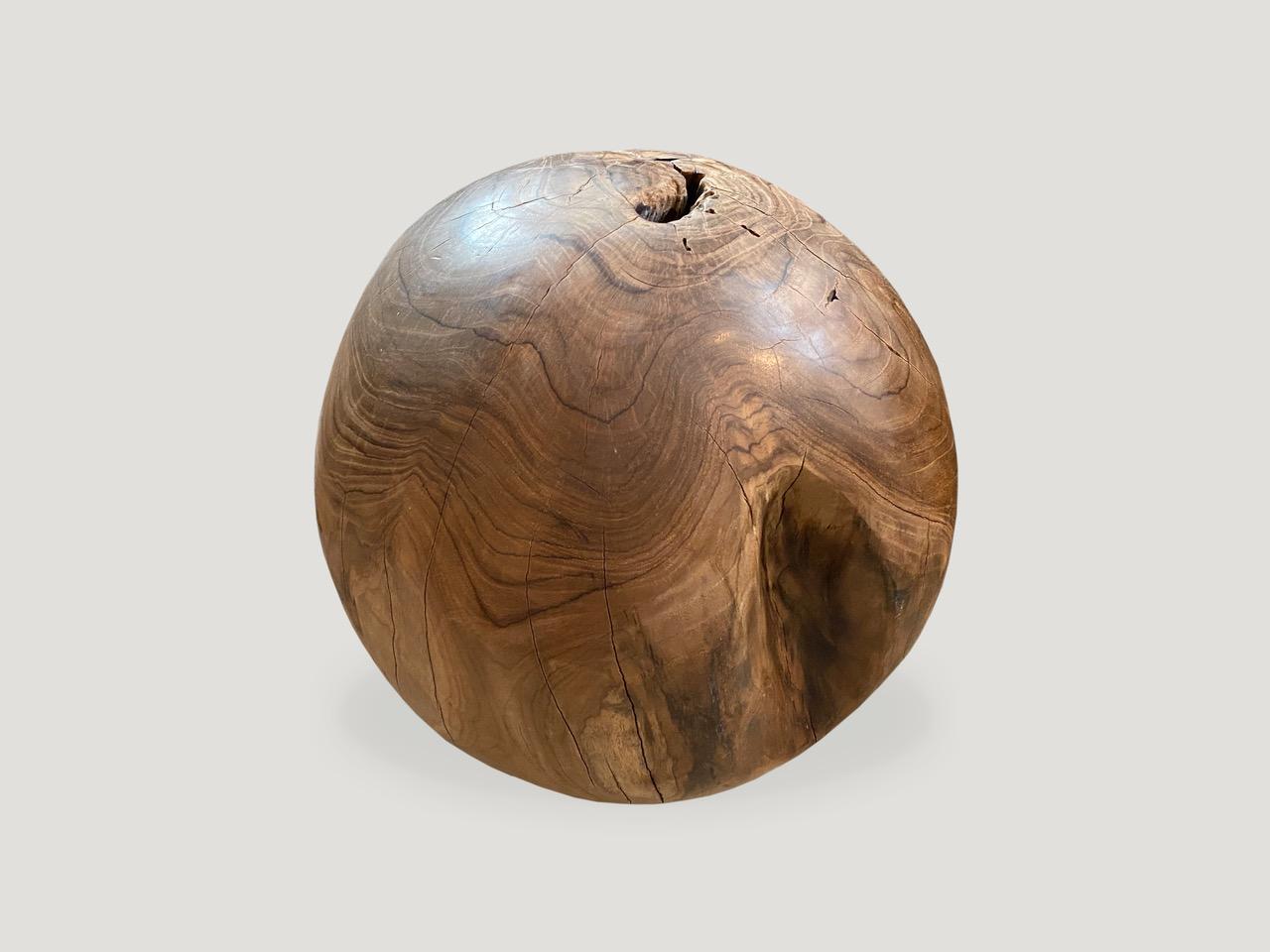 Natural teak wood root sphere. The outer section is polished and the inner root left smooth in contrast. We have a collection available--all vary slightly in diameter. The price reflects the one shown. 16