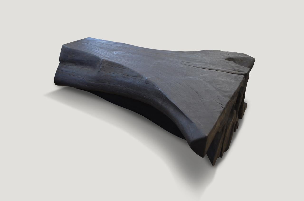 Organic shaped reclaimed teak wood root coffee table. Burnt, sanded and sealed with a smooth finish.

The Triple Burnt Collection represents a unique line of modern furniture made from solid organic wood. Burnt three times to produce a rich,