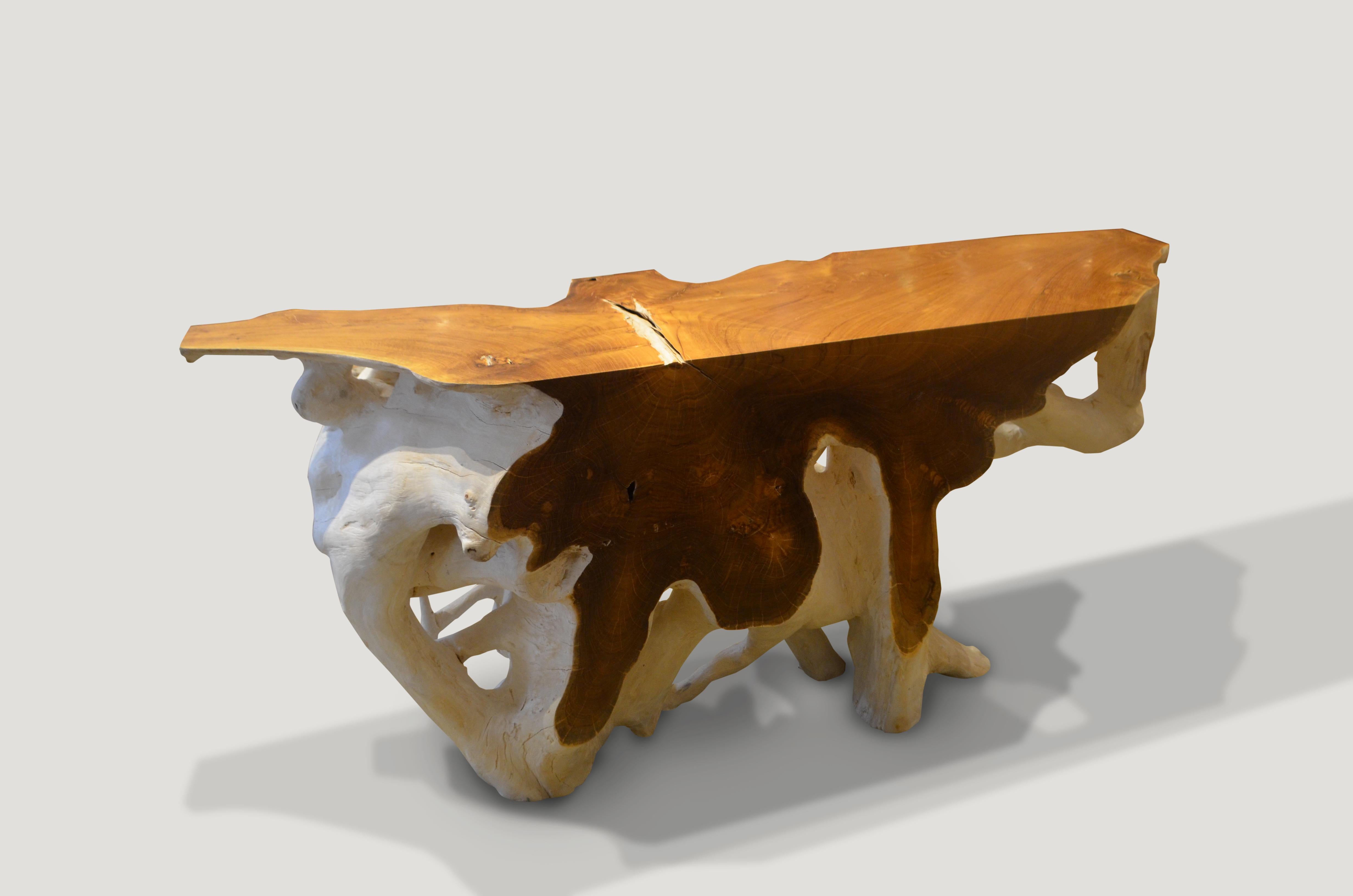 The flat sections of this beautiful teak wood console have been polished to enhance the natural reclaimed teak wood. The organic sections have been bleached revealing a stunning contrast.

Andrianna Shamaris. The Leader In Modern Organic