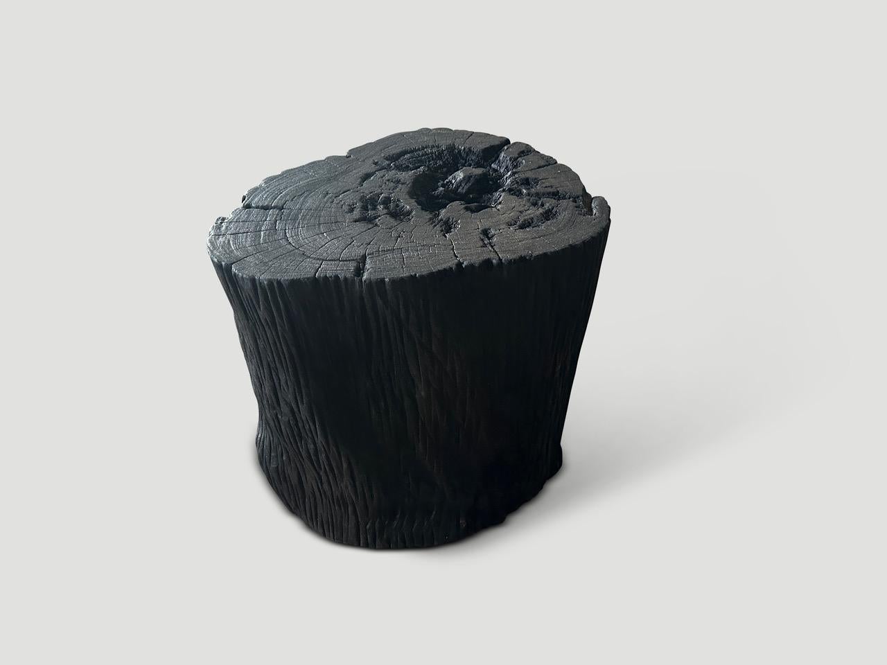Reclaimed ulin wood side table or stool. Also known as Iron wood. Charred sanded and sealed whilst respecting the natural organic wood.

The Triple Burnt Collection represents a unique line of modern furniture made from solid reclaimed wood. Burnt