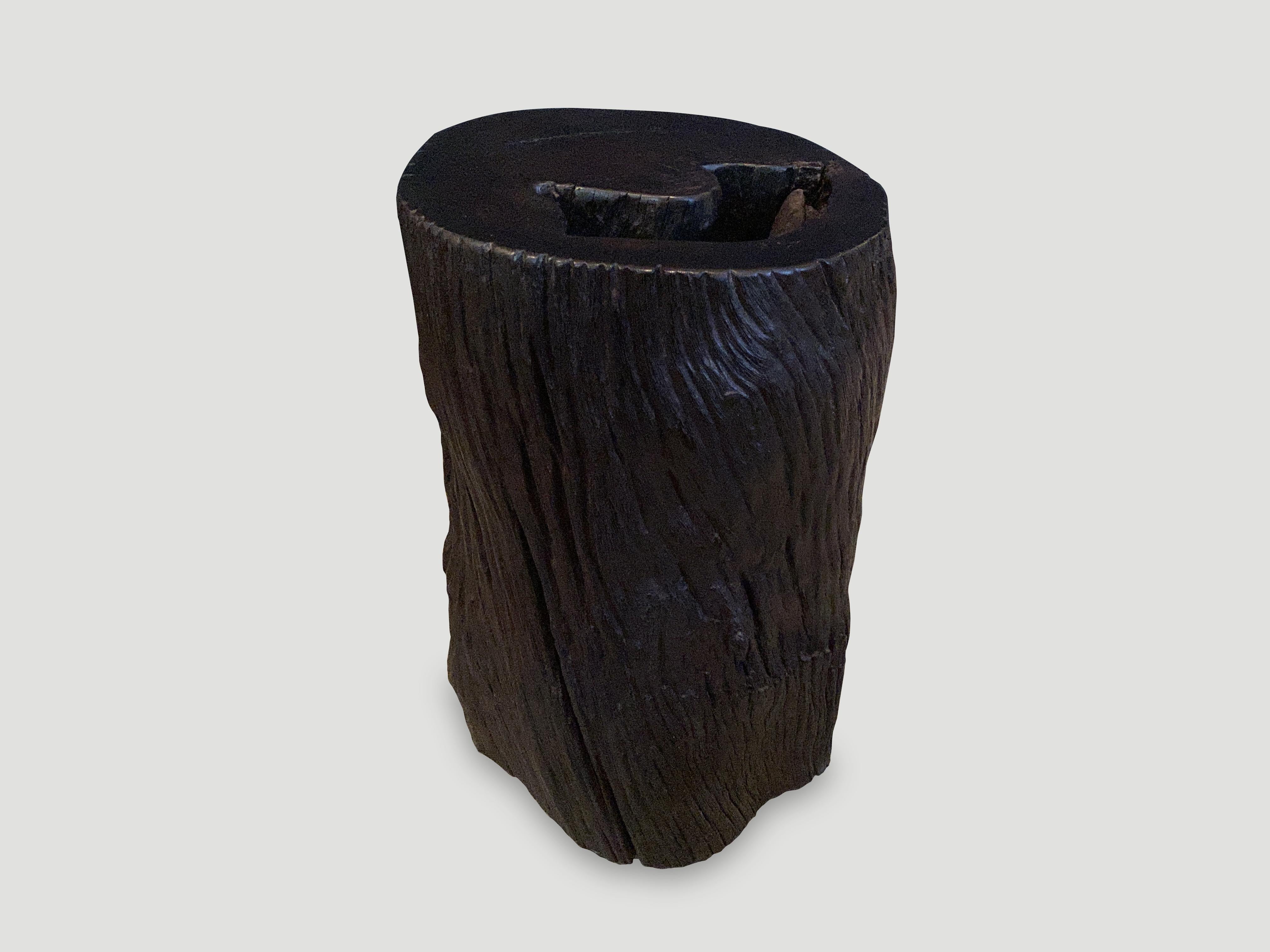 Reclaimed Ulin wood cylinder side table or stool. Also known as Iron wood. Charred sanded and sealed and carved into a minimalist shape whilst respecting the natural organic wood. We added a polish revealing the beautiful wood grain. We have a