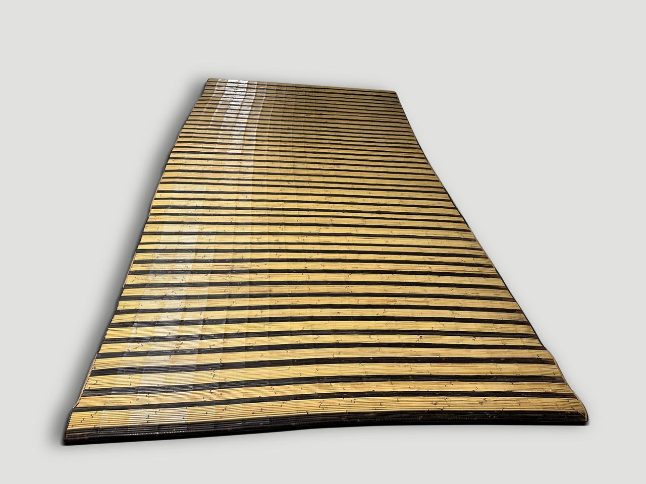 Hand made vintage bamboo mat from Borneo in natural and espresso colors. An unusual long size and unique two toned.

Andrianna Shamaris. The Leader In Modern Organic Design.
