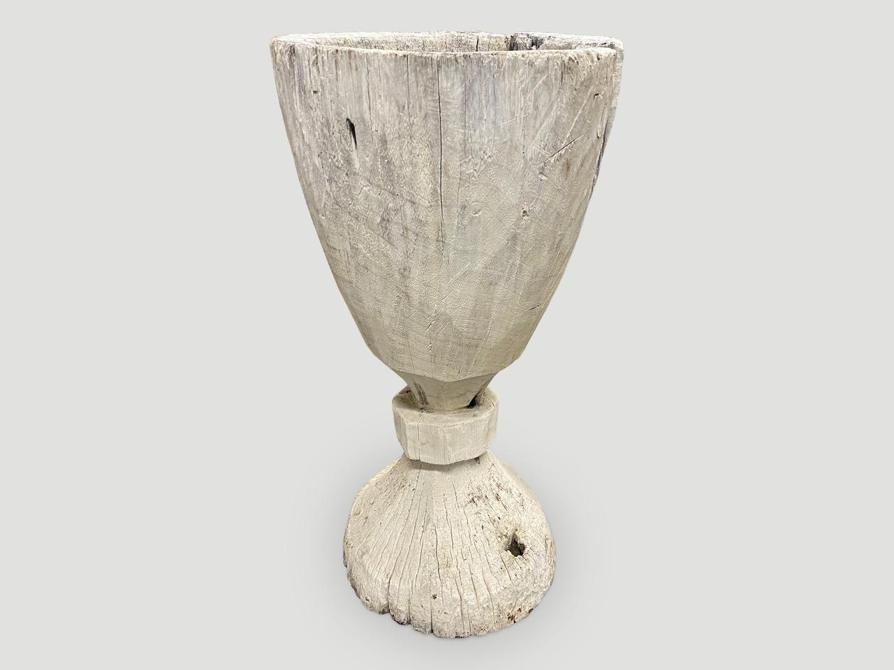 Antique rice pounder carved from a single teak root and bleached. Beautiful as a sculpture, holding towels or great as a champagne holder for parties. Also as a table base with a glass top.

This vessel was sourced in the spirit of Wabi-Sabi, a