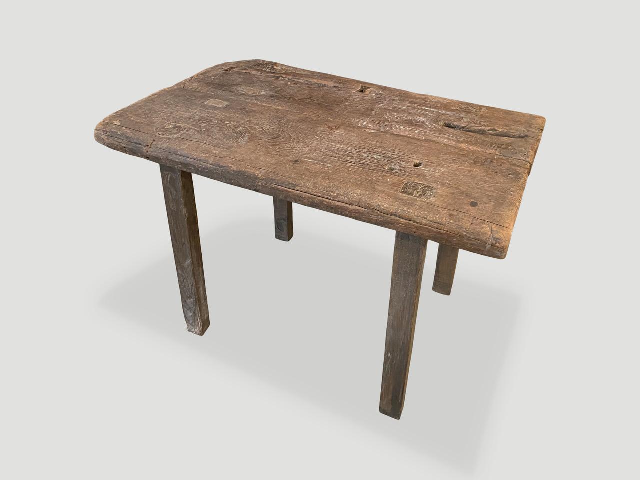 Antique hand carved Wabi Sabi side table or small console table. We cut a single thick panel of teak and joined them together and added butterfly detail to the top. Beautiful soft rounded edges on this two inch thick, aged teak wood, celebrating the