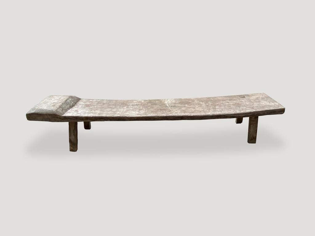 Impressive antique bench hand carved from a single teak panel.

This bench was sourced in the spirit of wabi-sabi, a Japanese philosophy that beauty can be found in imperfection and impermanence. It is a beauty of things modest and humble. A