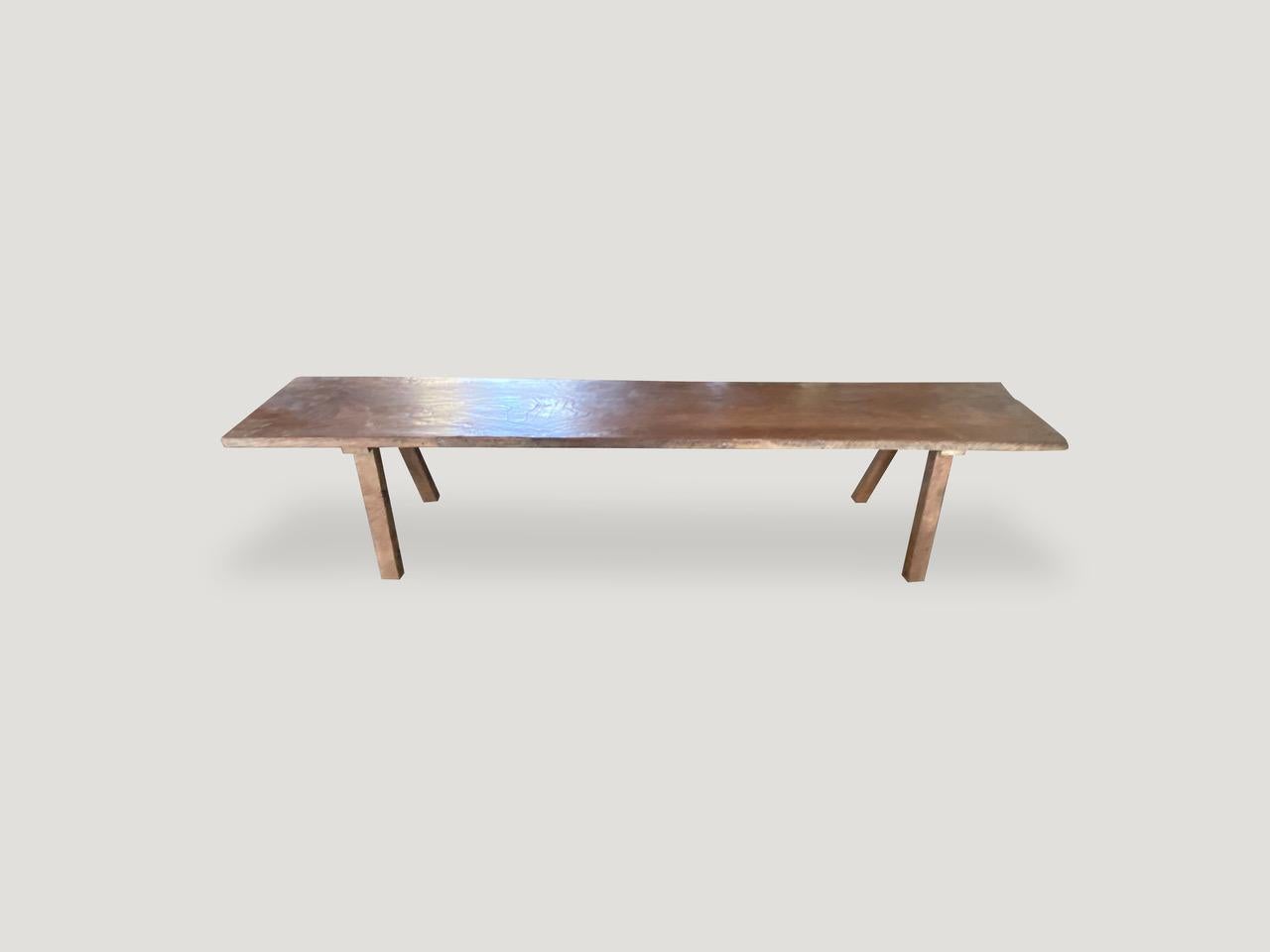 Antique single slab, natural aged teak wood bench. Celebrating the cracks and crevices and all the other marks that time and loving use have left behind.

This bench was sourced in the spirit of wabi-sabi, a Japanese philosophy that beauty can be