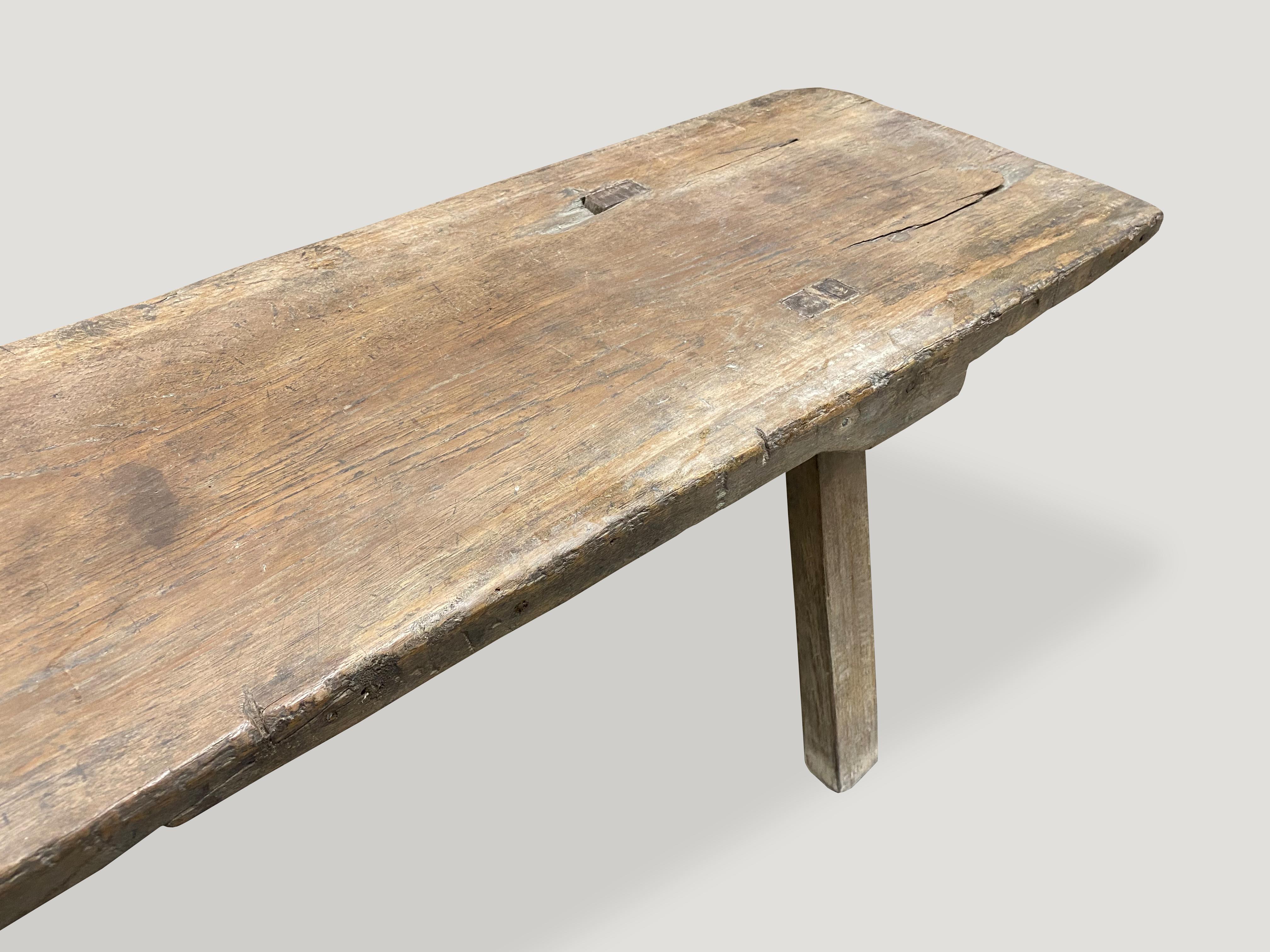 Antique bench made from a single reclaimed panel with beautiful patina. Perfection is imperfection.

This bench or coffee table was sourced in the spirit of wabi-sabi, a Japanese philosophy that beauty can be found in imperfection and
