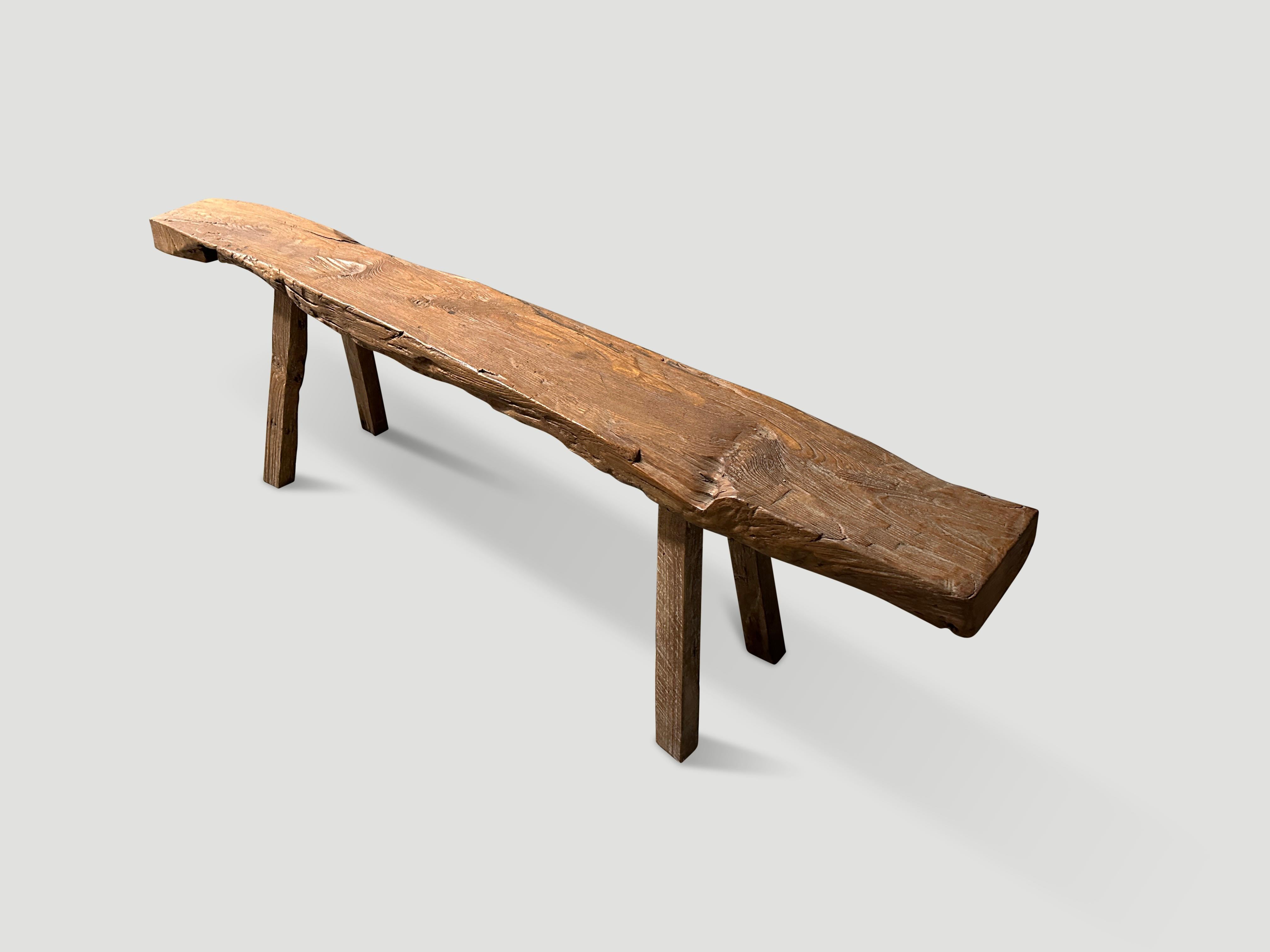 Antique bench hand made from a single thick panel of teak wood with lovely patina.

This bench was hand made in the spirit of Wabi-Sabi, a Japanese philosophy that beauty can be found in imperfection and impermanence. It is a beauty of things modest