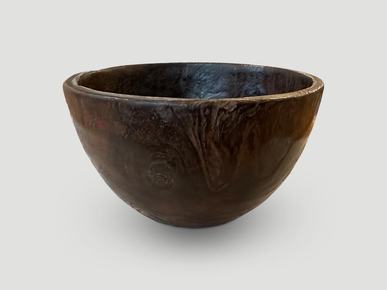 Beautiful antique bowl hand carved from a single piece of teak wood.

This bowl was sourced in the spirit of Wabi-Sabi, a Japanese philosophy that beauty can be found in imperfection and impermanence. It is a beauty of things modest and humble. A