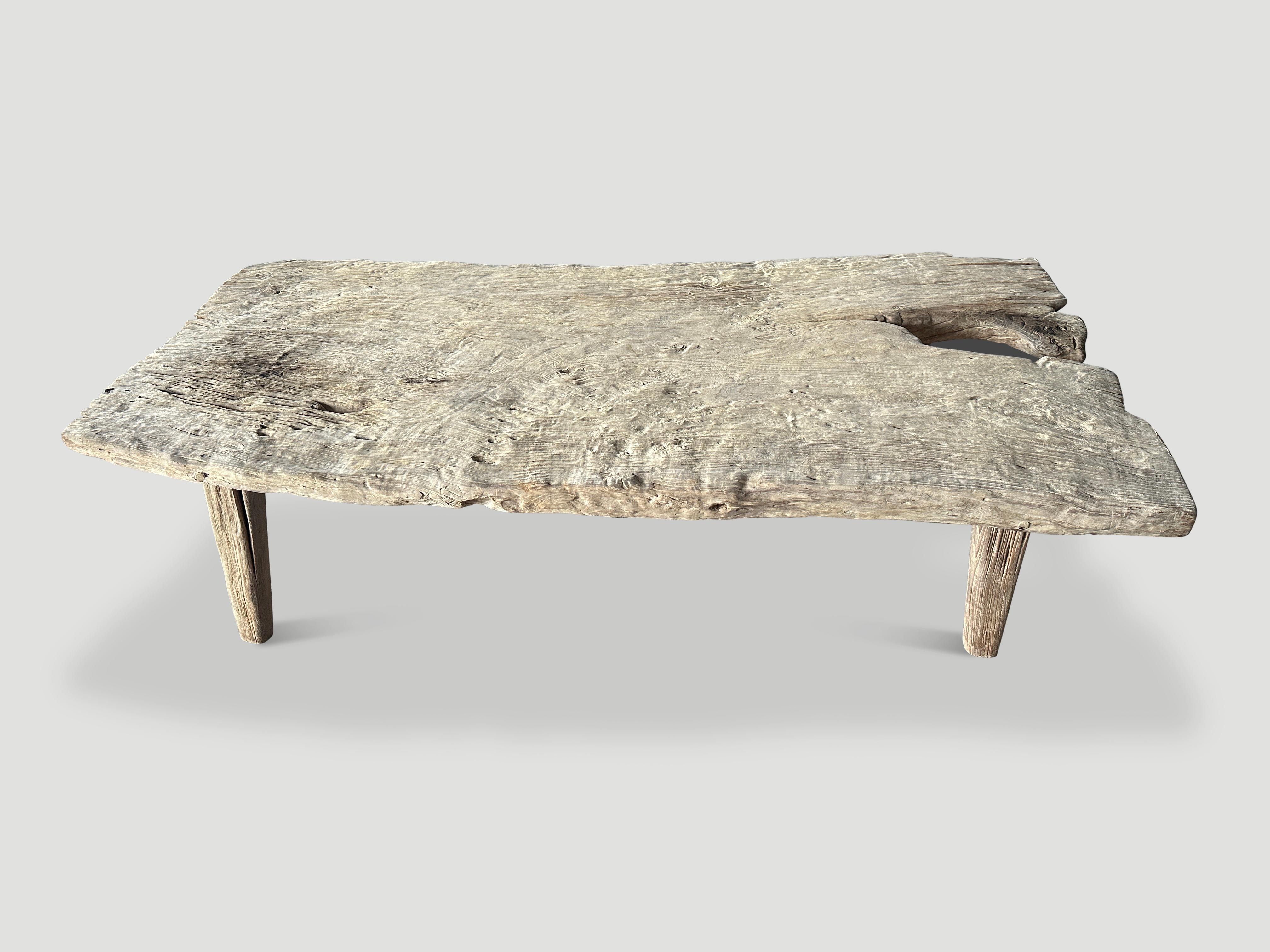 Beautiful century old two inch single teak slab coffee table with impressive erosion detail. Left in the sun and sea salt air to naturally turn this pale tone. We added minimalist legs. It’s all in the details.

The St. Barts Collection features an