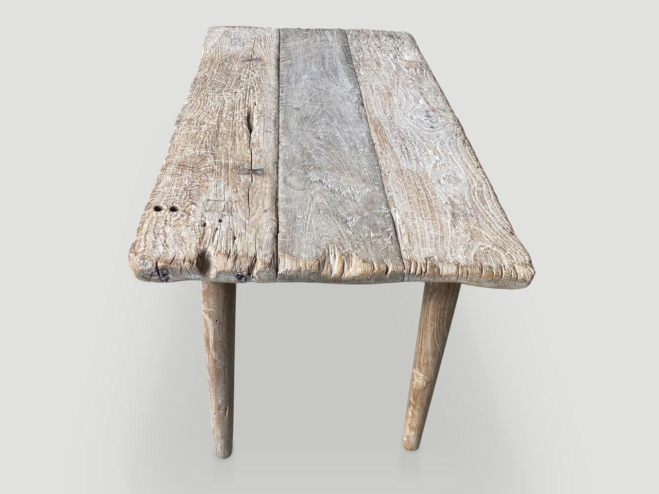 Beautiful aged teak wood panels joined together with lovely patina, soft rounded edges and butterflies inlaid into the wood. Celebrating the cracks and crevices and all the other marks that time and loving use have left behind. We added minimalist