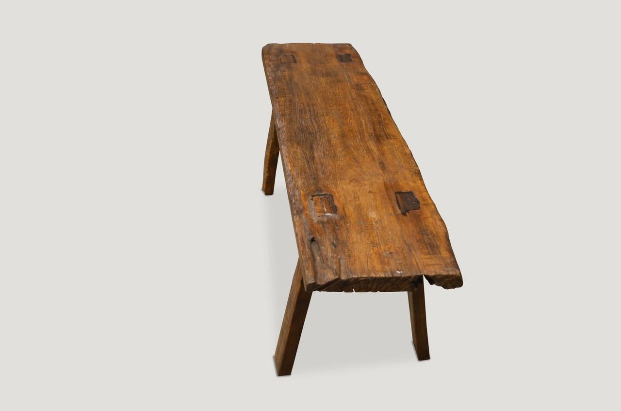 Antique natural aged teak wood bench or shelf. The top is hand carved from a single panel. Perfect for inside or outside living.

This bench or shelf was sourced in the spirit of wabi-sabi, a Japanese philosophy that beauty can be found in