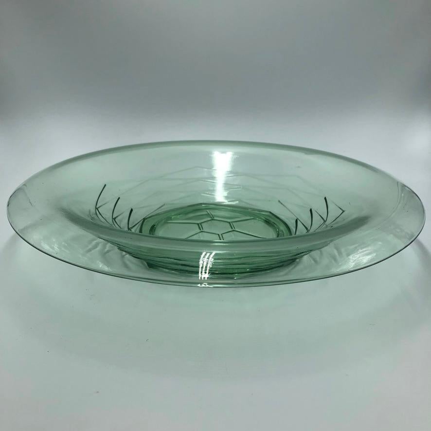 Beautiful green glass dish/bowl designed by Andries Copier for the Leerdam Glass Factory. 
The bowl has some traces of use it is still in a very good condition no chips.. A true gem on your table or counter top. 
Diameter 30,5 H 6 cm
      