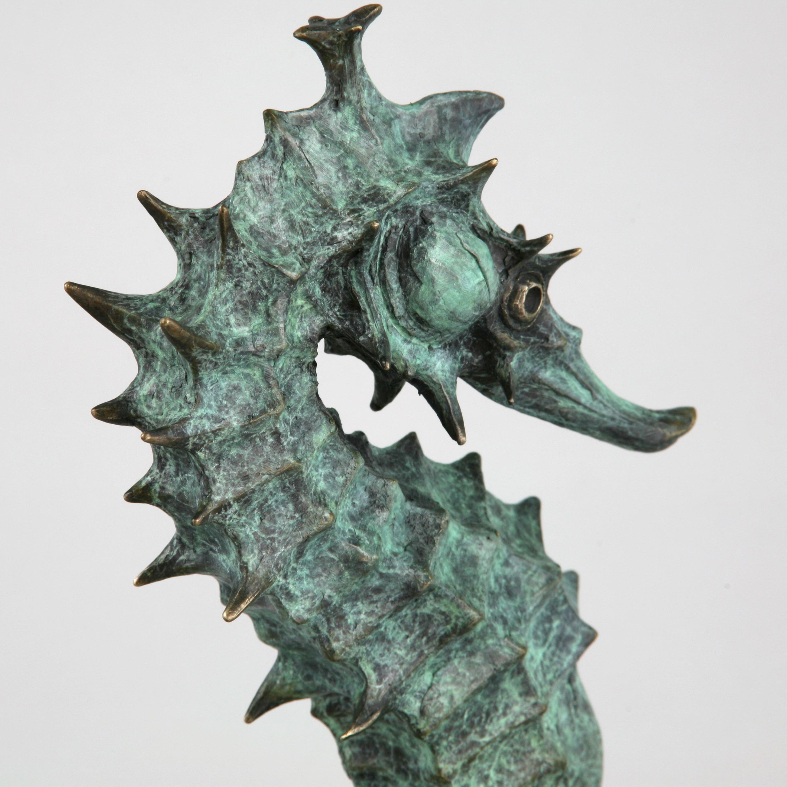 This contemporary marine sculpture by Andrzej Szymczyk depicts a seahorse and is expertly cast in bronze. The free standing piece is finished with a serene green coating, a hue reminiscent of its natural ocean environment, and features impressively