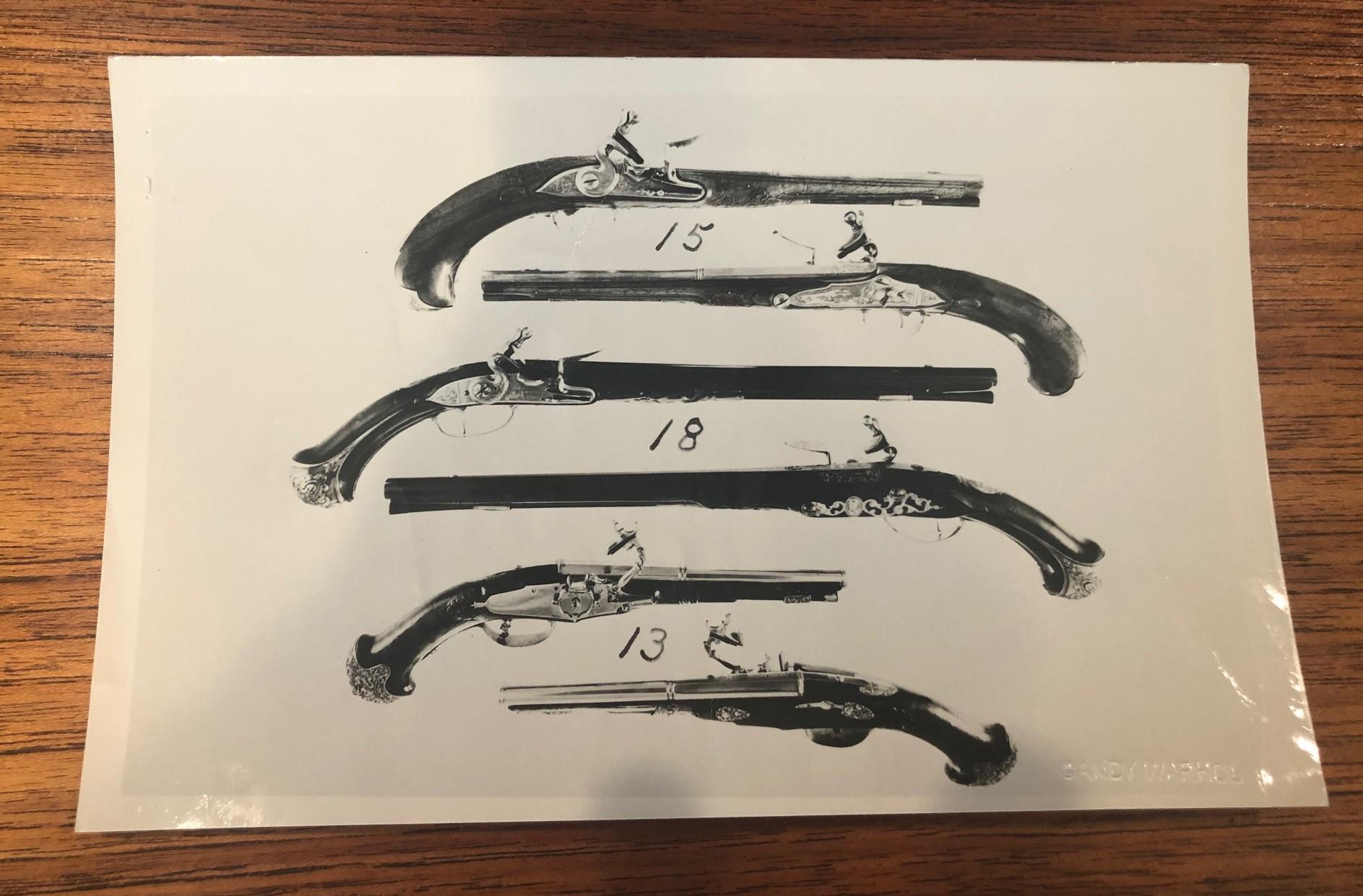Andy Warhol antique guns photograph, circa 1970s. The photo is stamped in verso 