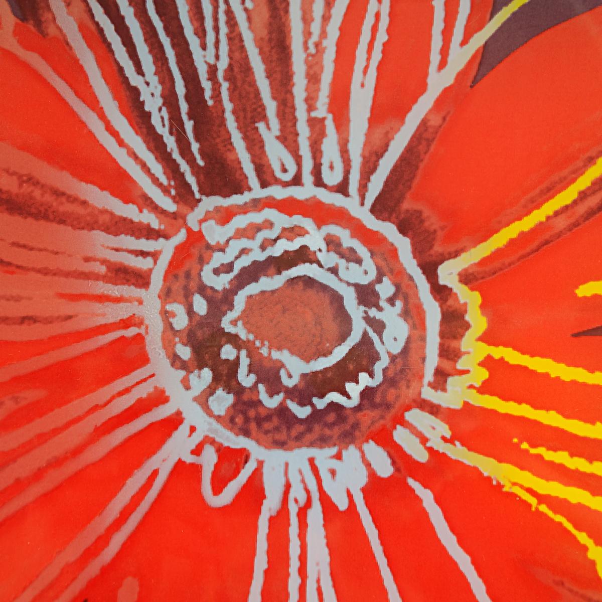 This huge painted glass bowl or plate depicts a Daisy by Andy Warhol, produced by the Rosenthal Studio Line. Its diameter is 53.5cm (over 21 inches).
The beautiful red flower is set amongst an aubergine/purple background with blue and