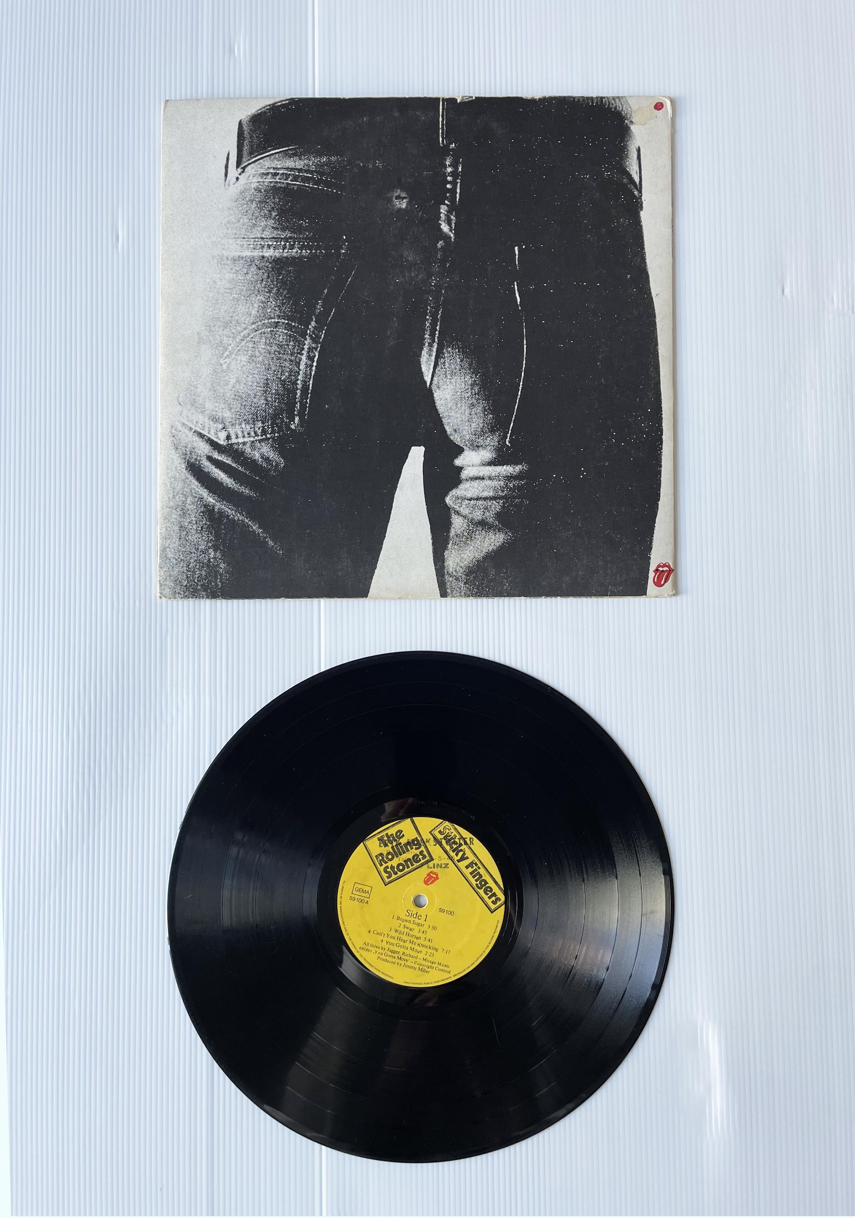 The Rolling Stones
Sticky Fingers, 1971
Vinyl LP, Zipper cover
Rolling Stones Records COC 59100
Cover art commissioned and designed by Andy Warhol, with autograph

COVER DELL’ALBUM THE ROLLING STONES
Copertina di carta
Paper cover

Con