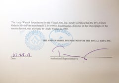 Fred Hughes Seated at a Table