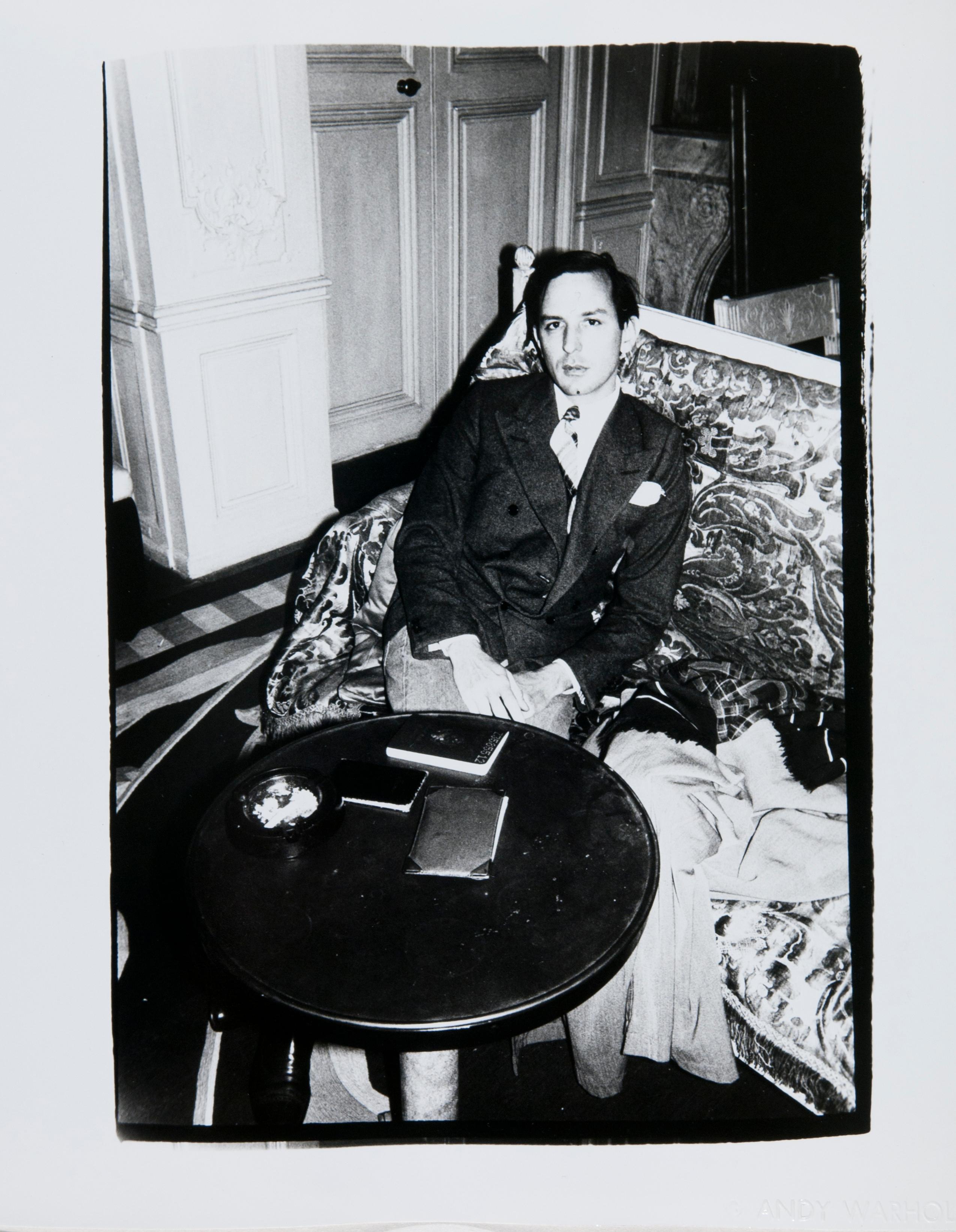 Andy Warhol Portrait Photograph - Photograph of Fred Hughes Seated at a Table