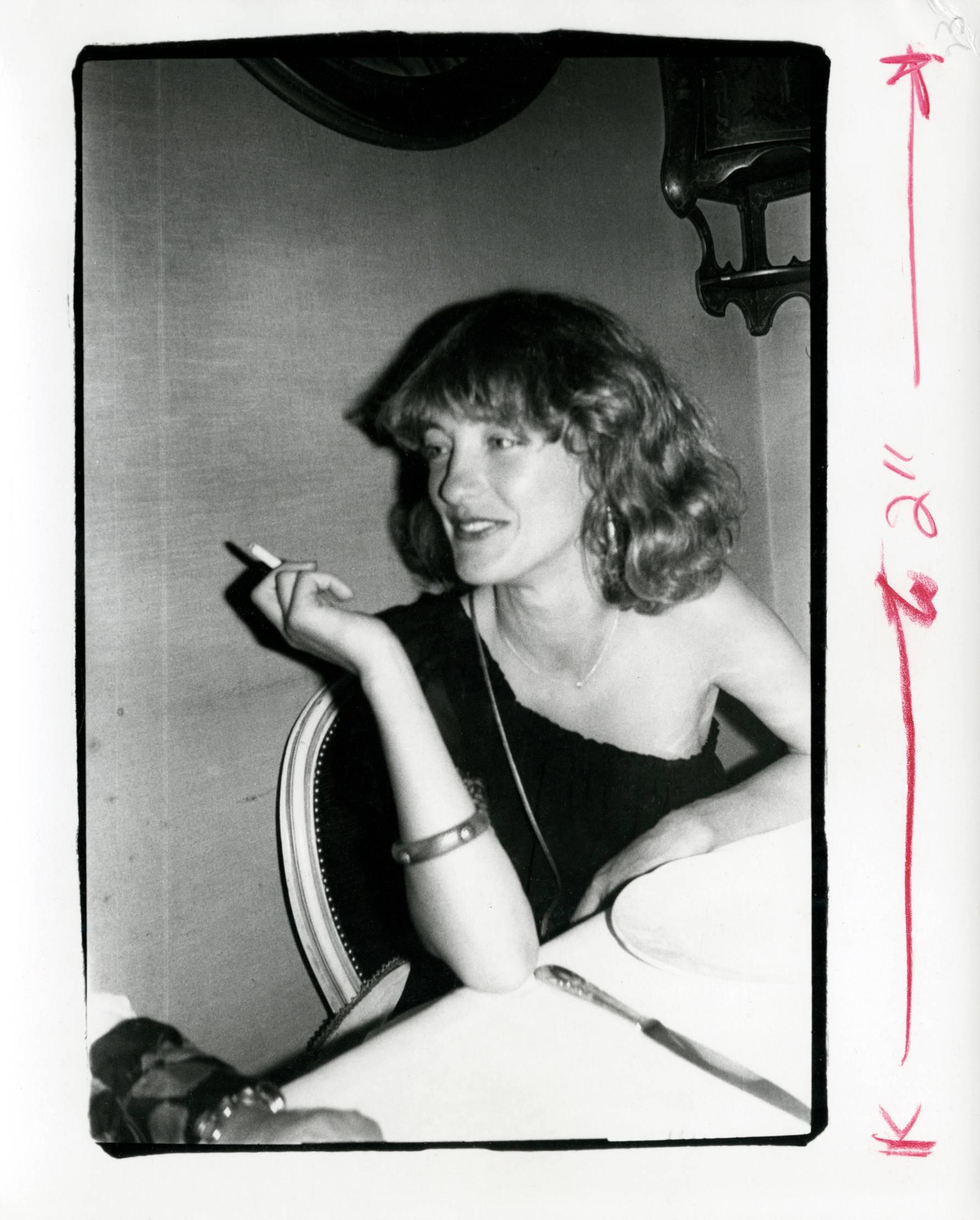 Black and White Photograph di Andy Warhol - Loulou de la Falaise Smoking, circa 1977-1978