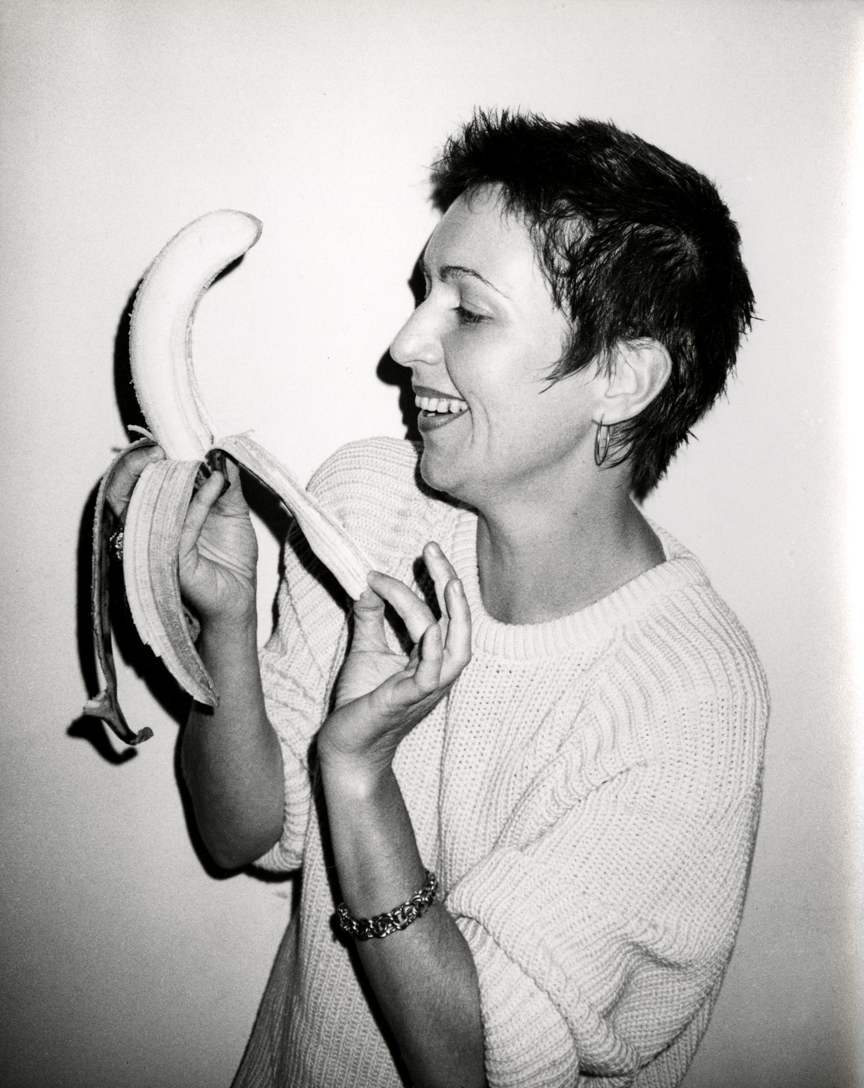 Andy Warhol, Photograph of Pat Hackett Peeling a Banana, circa 1986