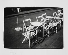 Gelatin silver print of Cafe Chairs and Tables on Street by Andy Warhol