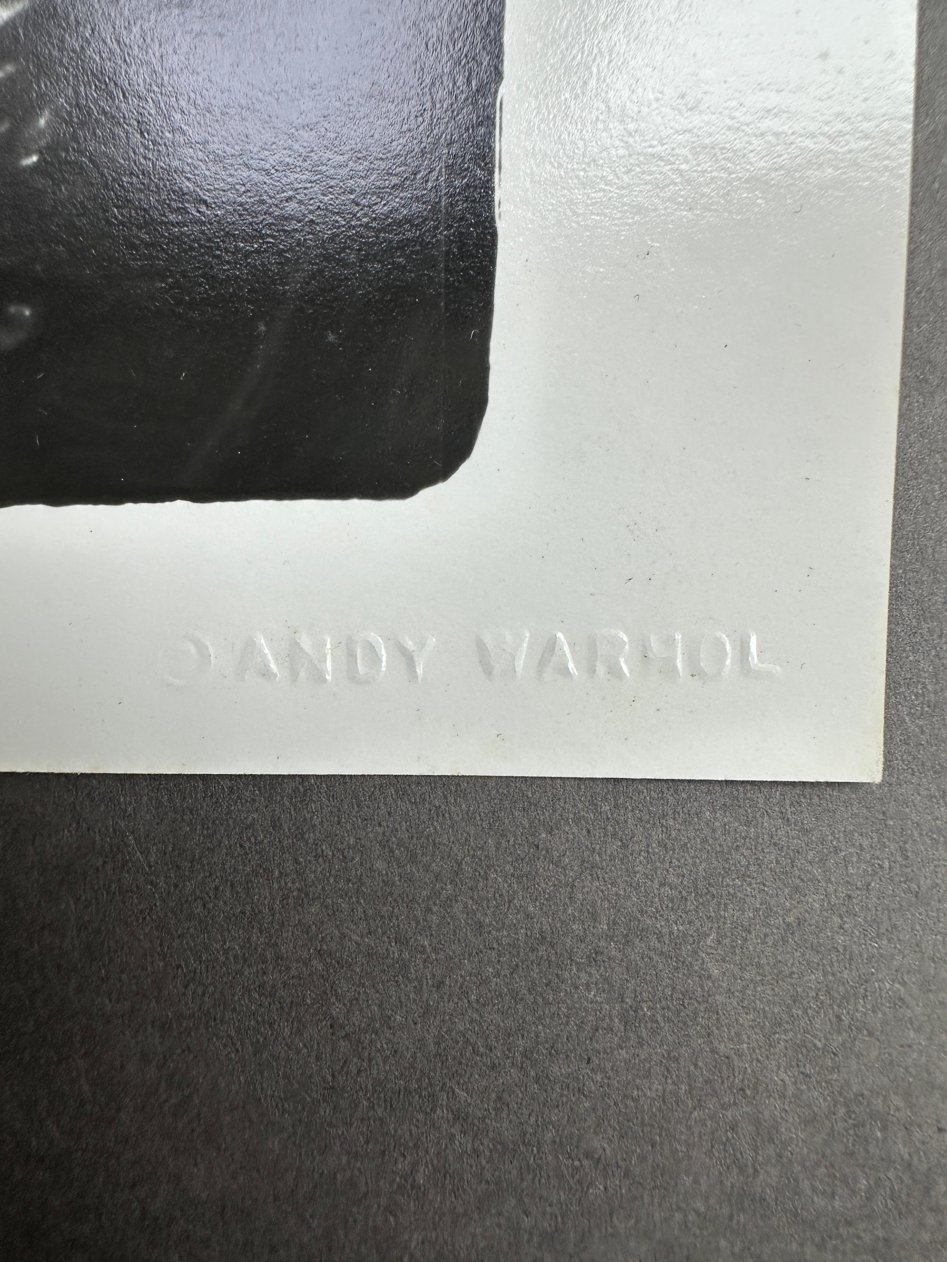 Jon Gould in Speedo in Palm Beach (Beige), Black and White Photograph, von Andy Warhol
