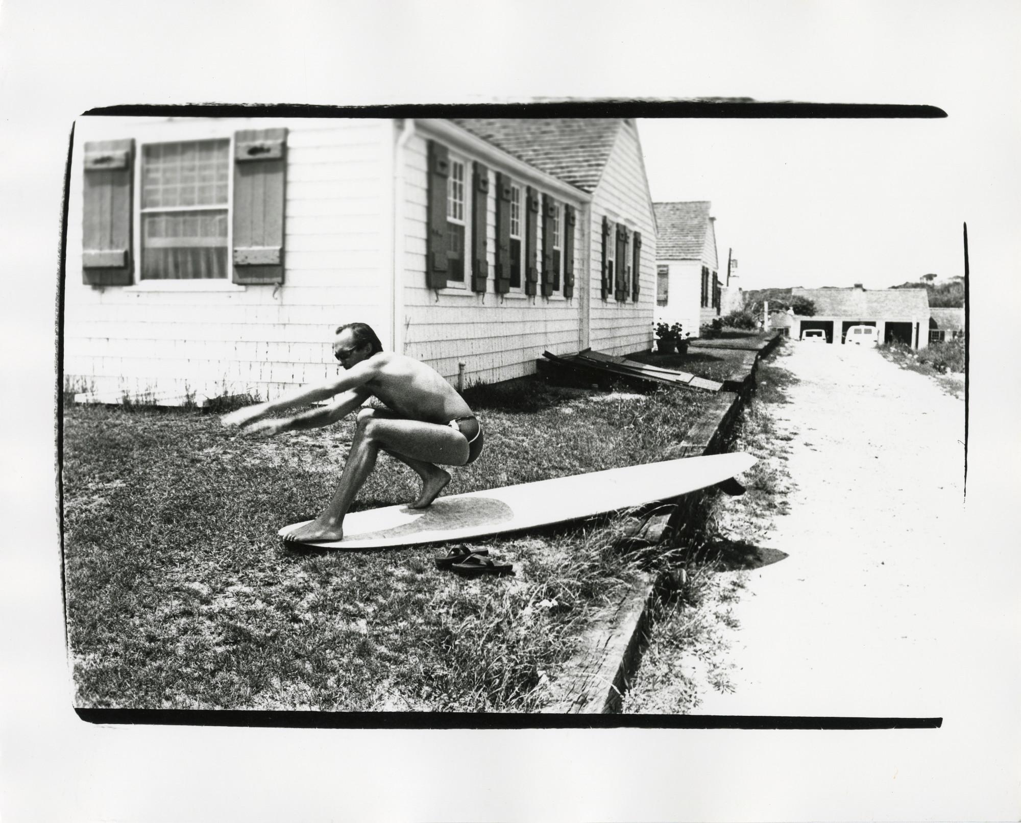 Andy Warhol Black and White Photograph - Jon Gould on surfboard in Montauk
