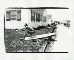 Vintage Jon Gould on surfboard in Montauk