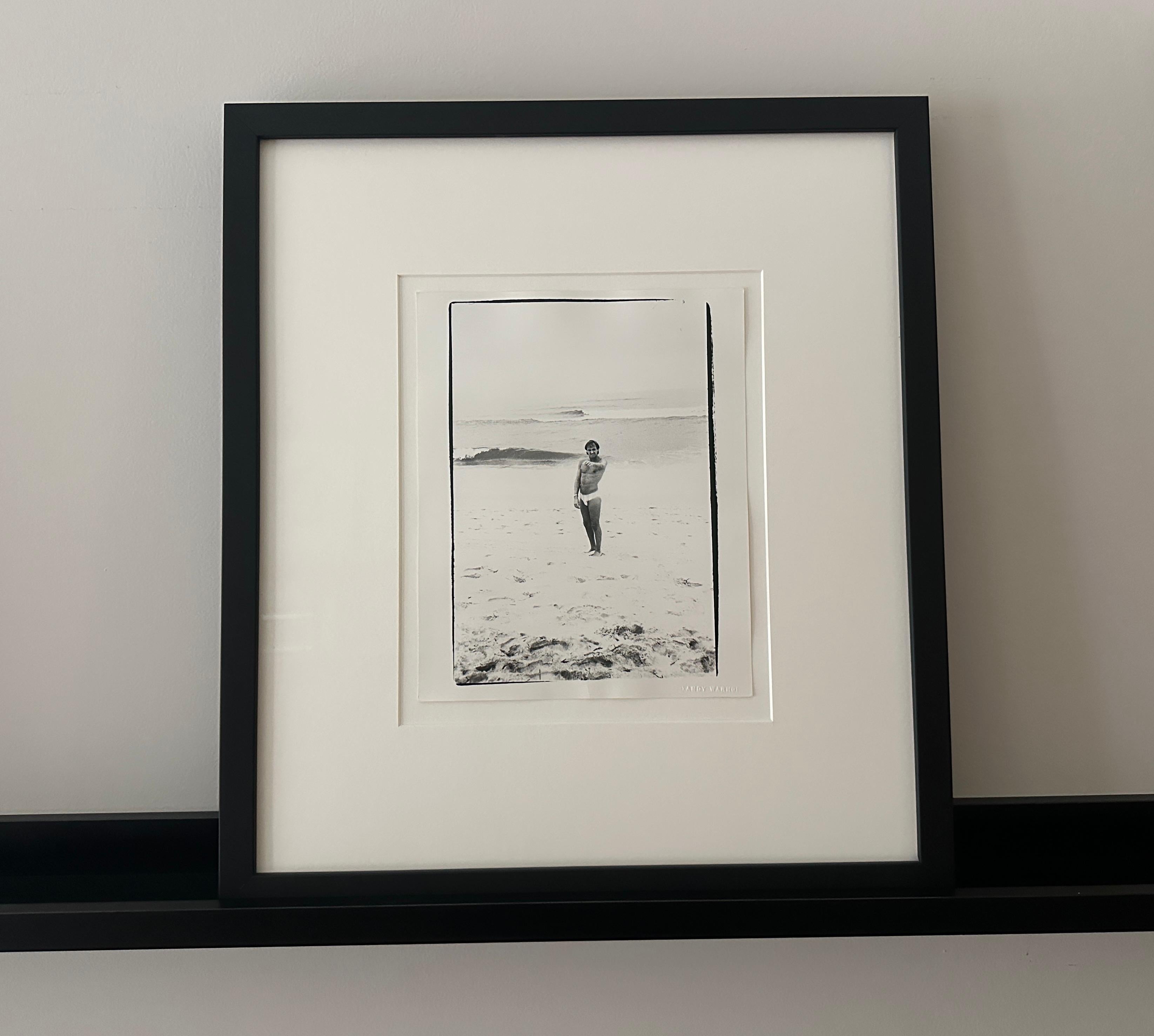 Jon Gould Pointing on Fire Island Beach - Photograph by Andy Warhol