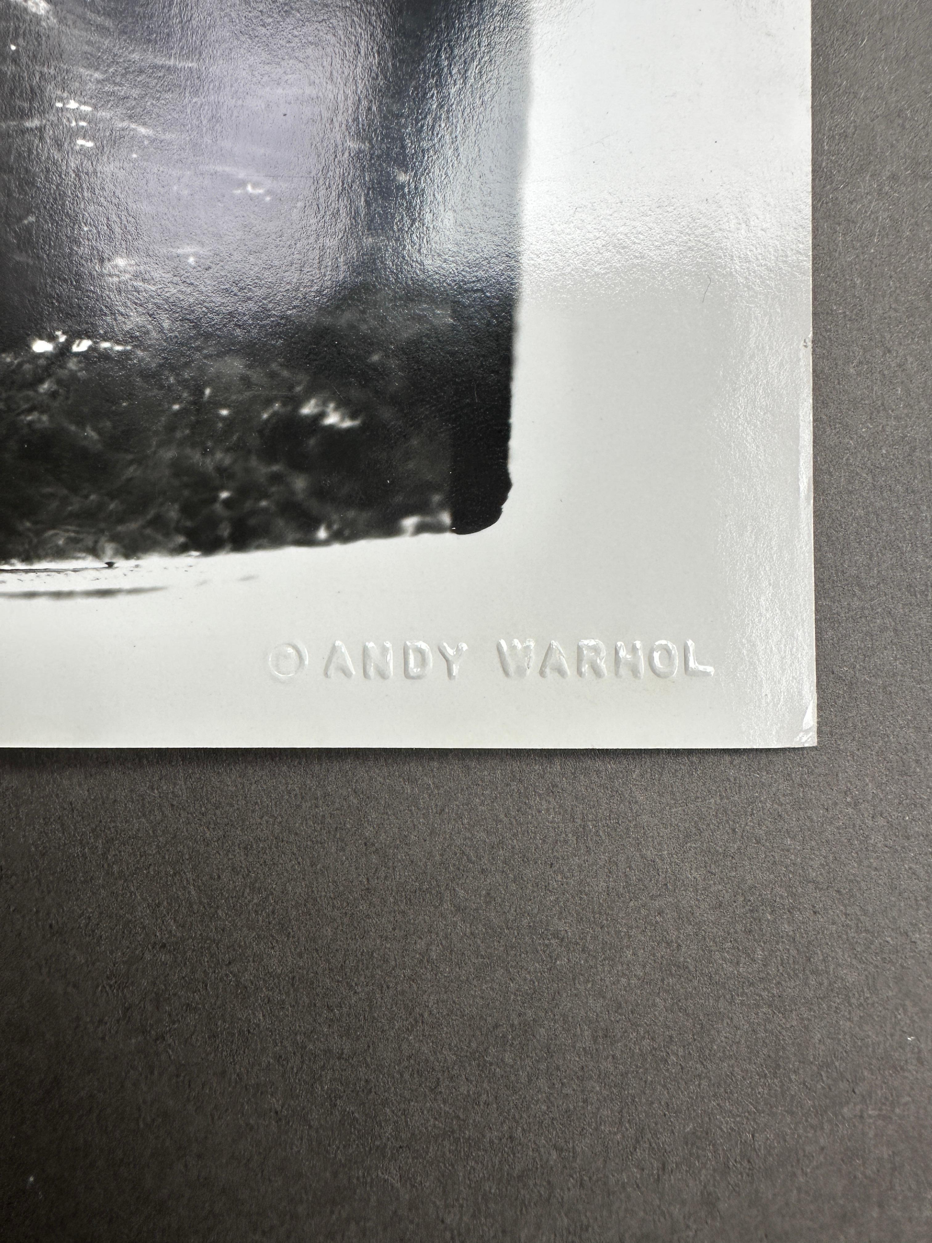 Jon Gould steso su una roccia a Montauk - Black and White Photograph Nero di Andy Warhol