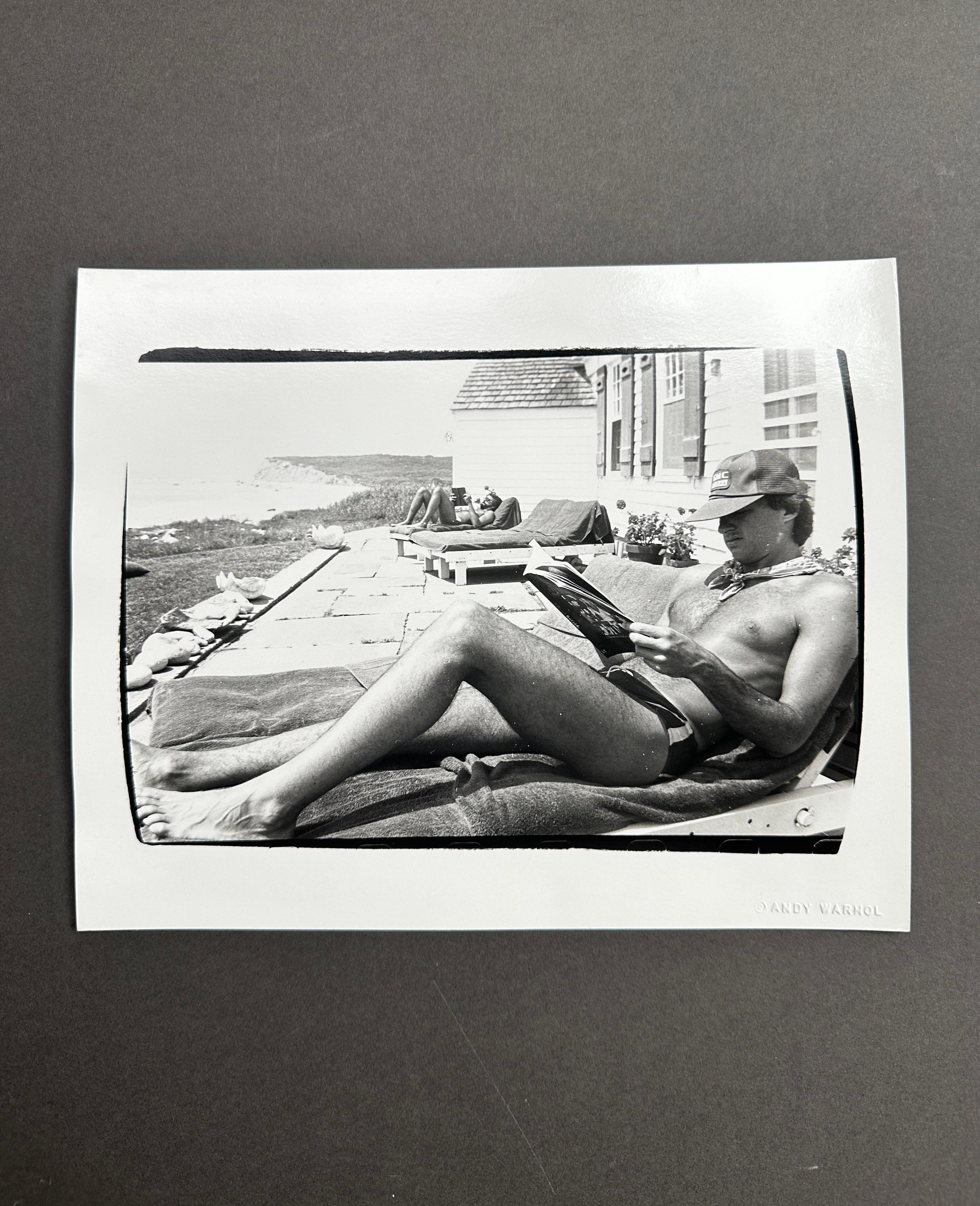 Jon Gould Sonnenbaden in Montauk – Photograph von Andy Warhol