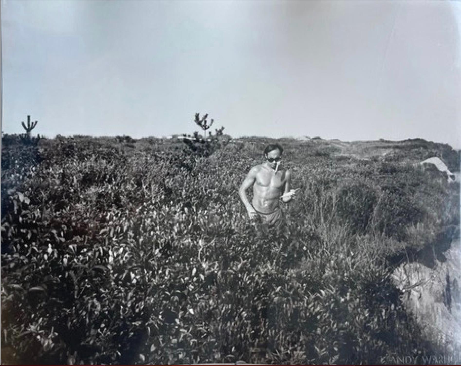 Andy Warhol Black and White Photograph - Jon Gould walking along cliff and on the beach in Montauk