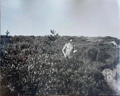 Jon Gould walking along cliff and on the beach in Montauk
