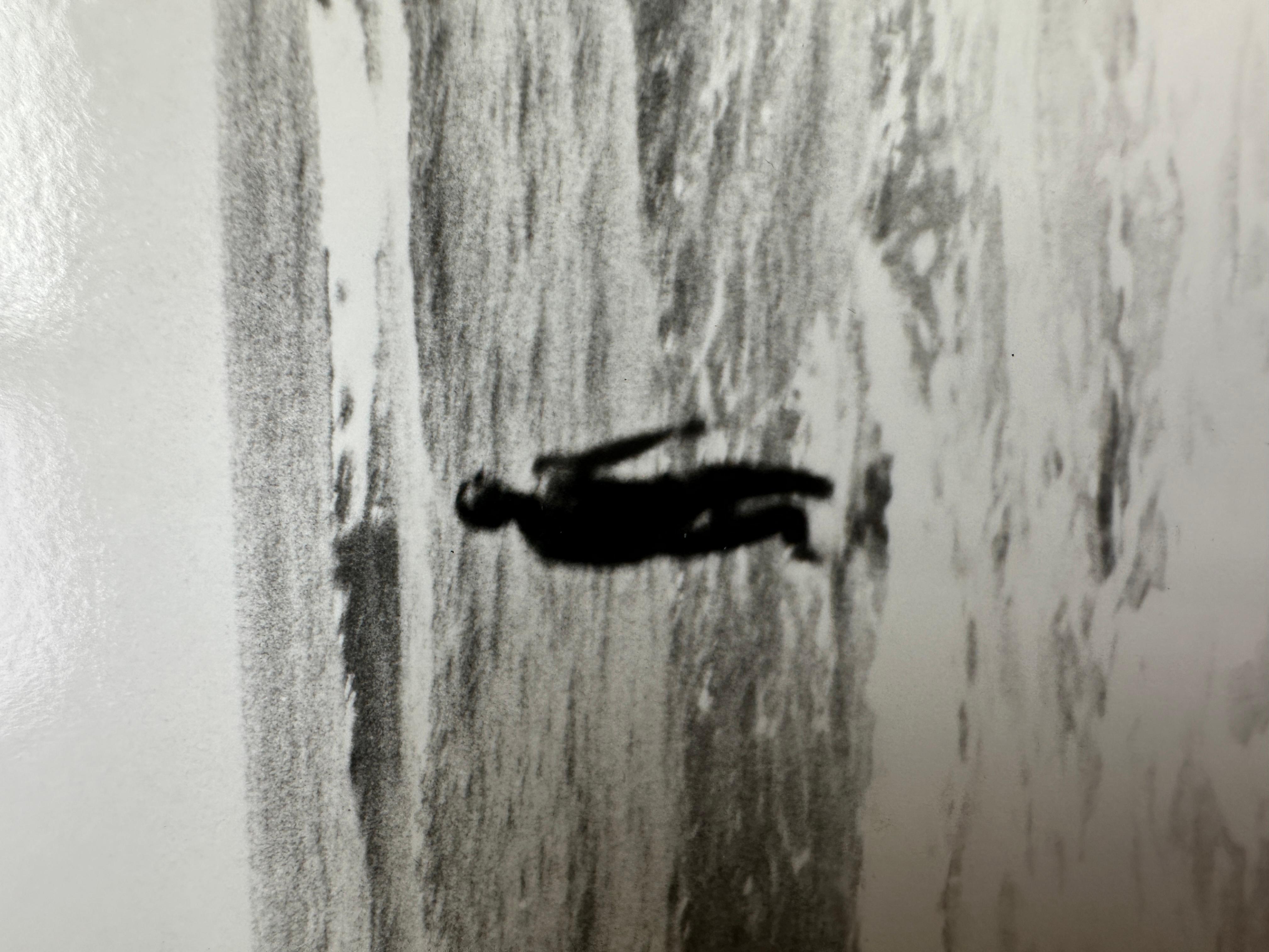 Jon Gould che cammina nel surf a Montauk - Black and White Photograph Grigio di Andy Warhol
