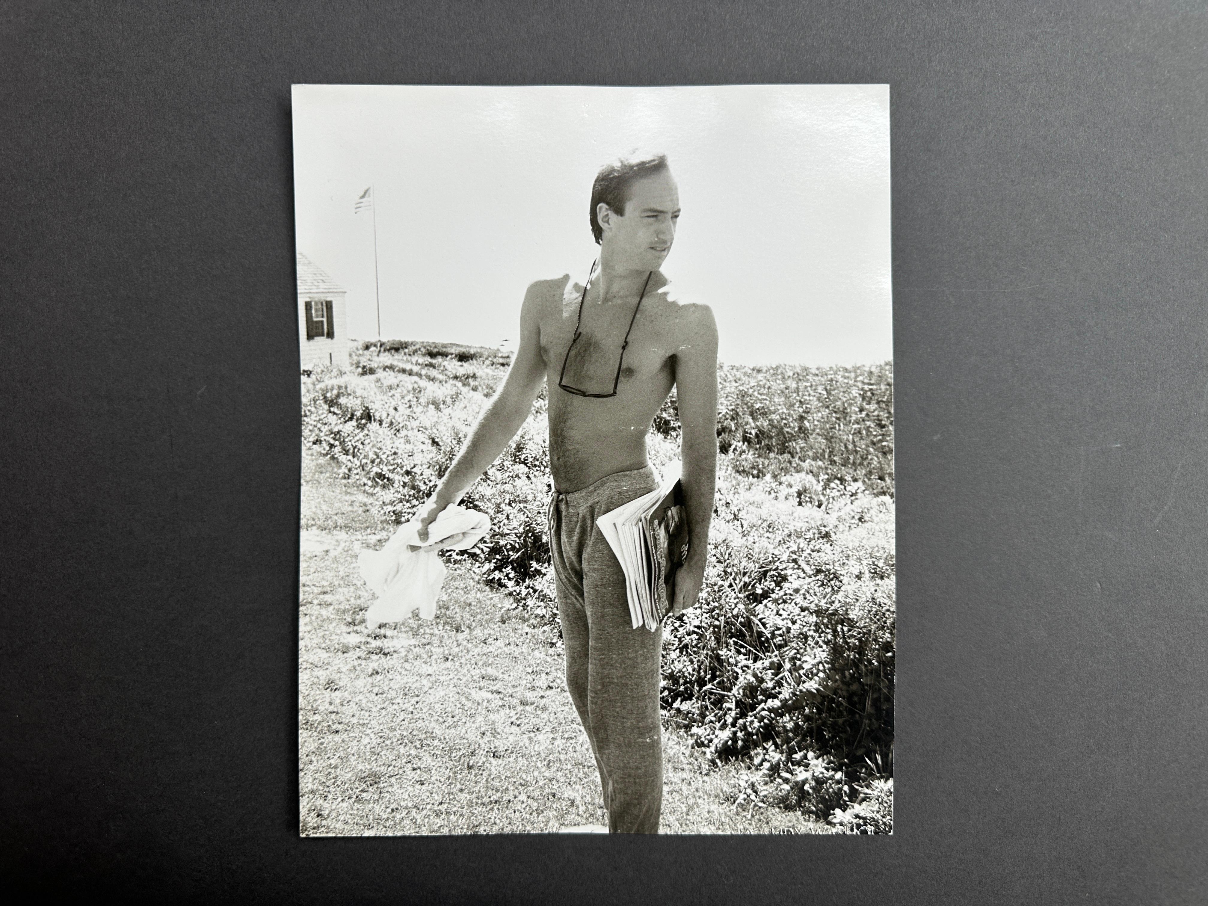 Jon Gould with Magazines in Montauk - Pop Art Photograph by Andy Warhol