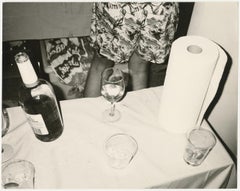 Liquor bottle, glasses and paper towel still life