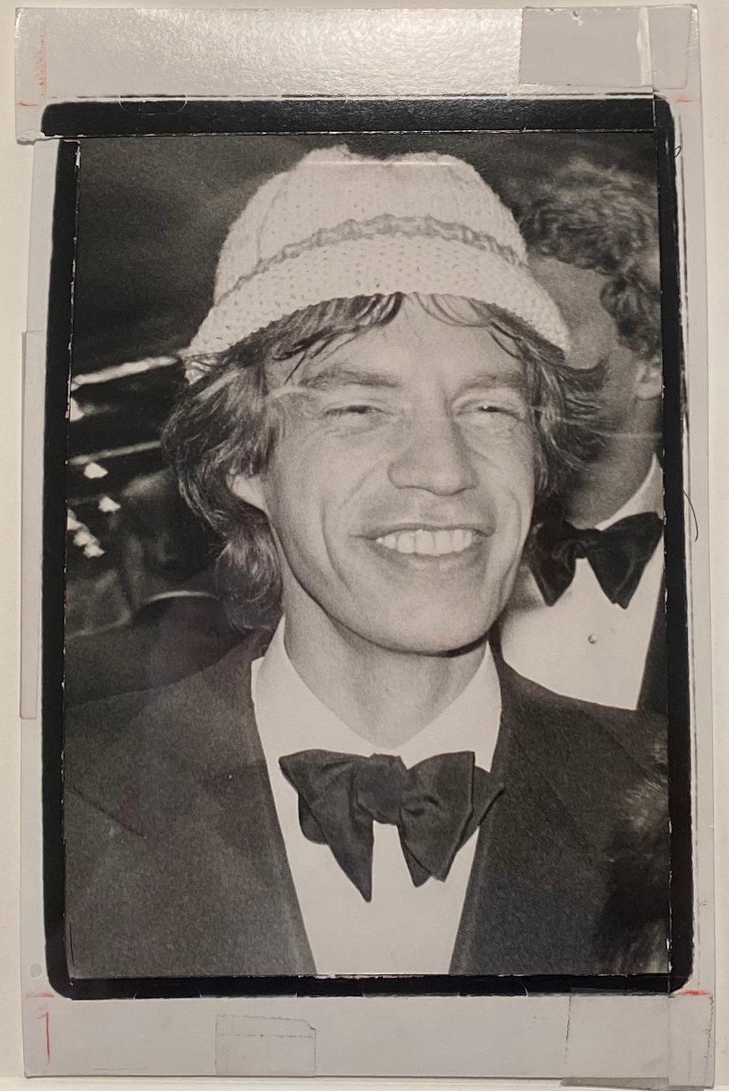 Mick Jagger in hat for Interview Magazine - Photograph by Andy Warhol