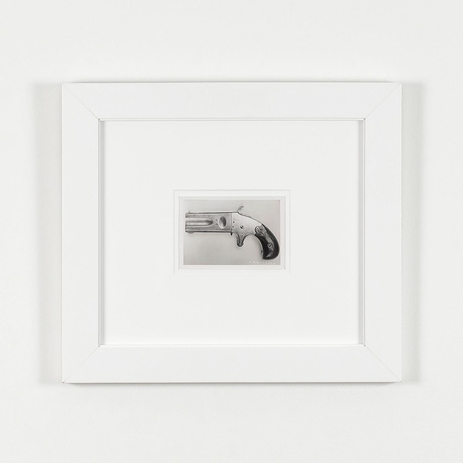 One Pistol  - American Modern Photograph by Andy Warhol