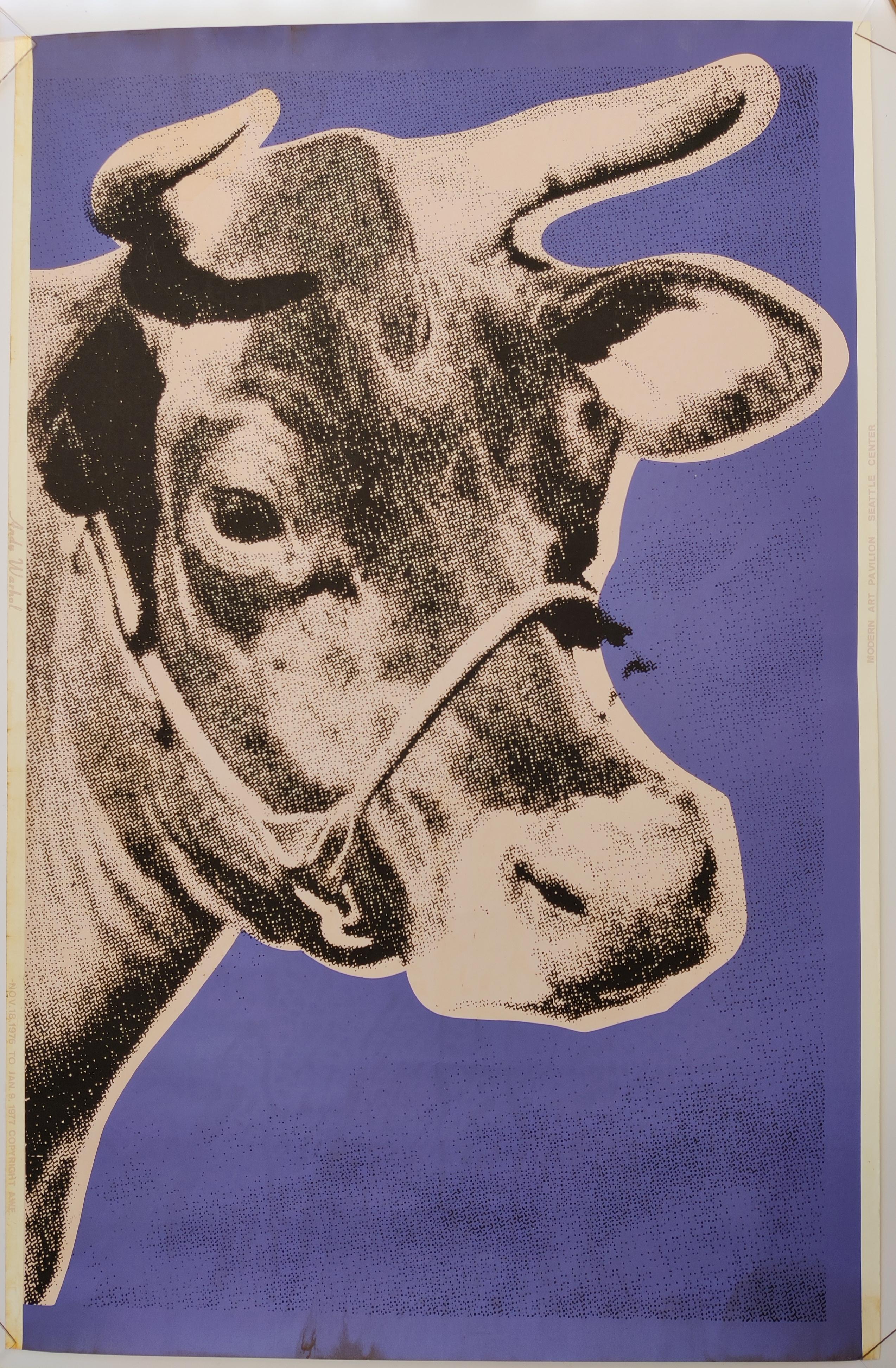 Andy Warhol 
Cow , 1971
Silkscreen on wallpaper, unsigned
Cow with a soft pink background, surrounded by a purple ground. 
Left margin in the same soft pink reading "Andy Warhol" and a bit further down "NOV. 18, 1976 TO JAN. 9, 1977 COPYRIGHT