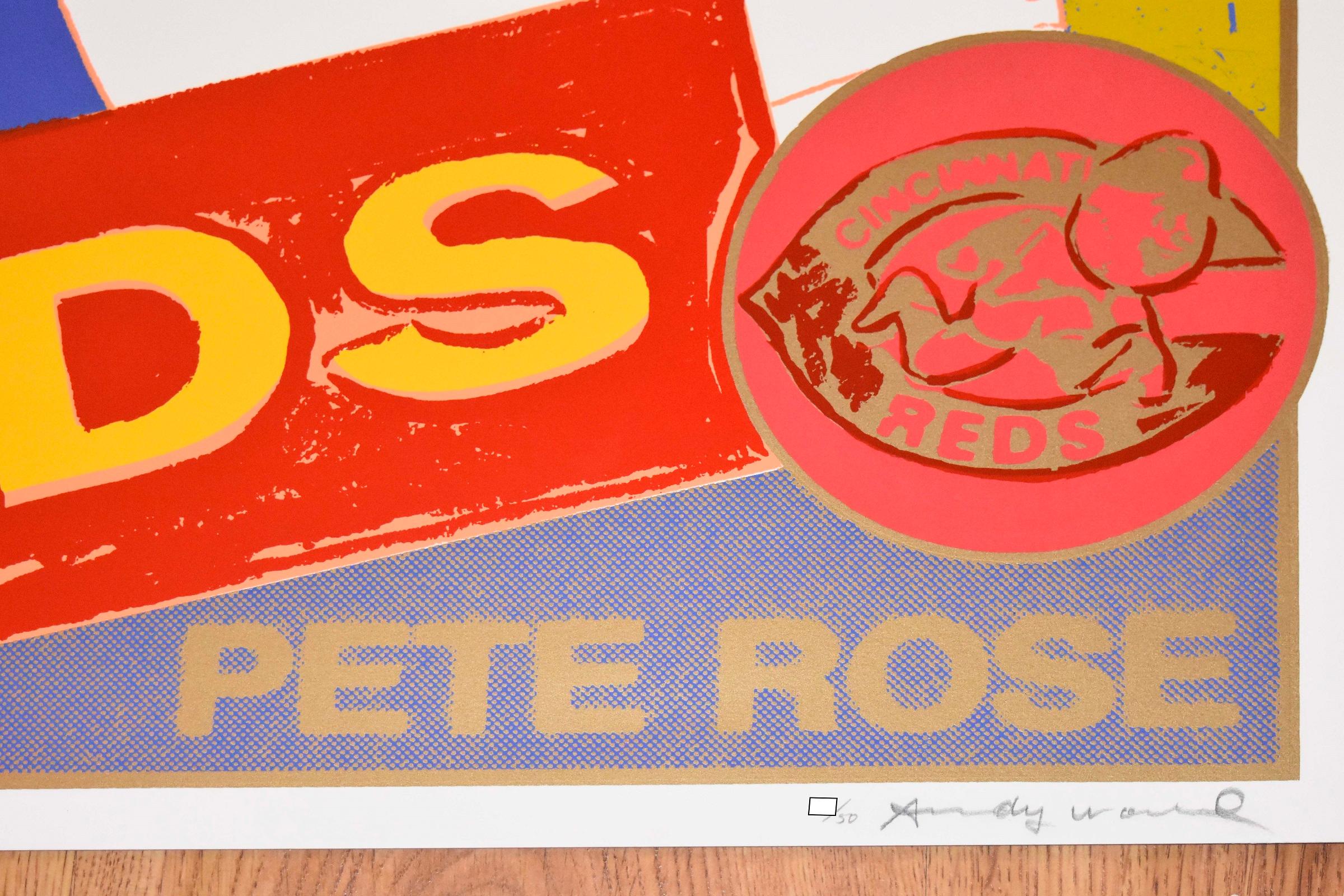 This Warhol work consists of a blue and gold background with a portrait of Pete Rose holding a baseball bat and a banner that says 