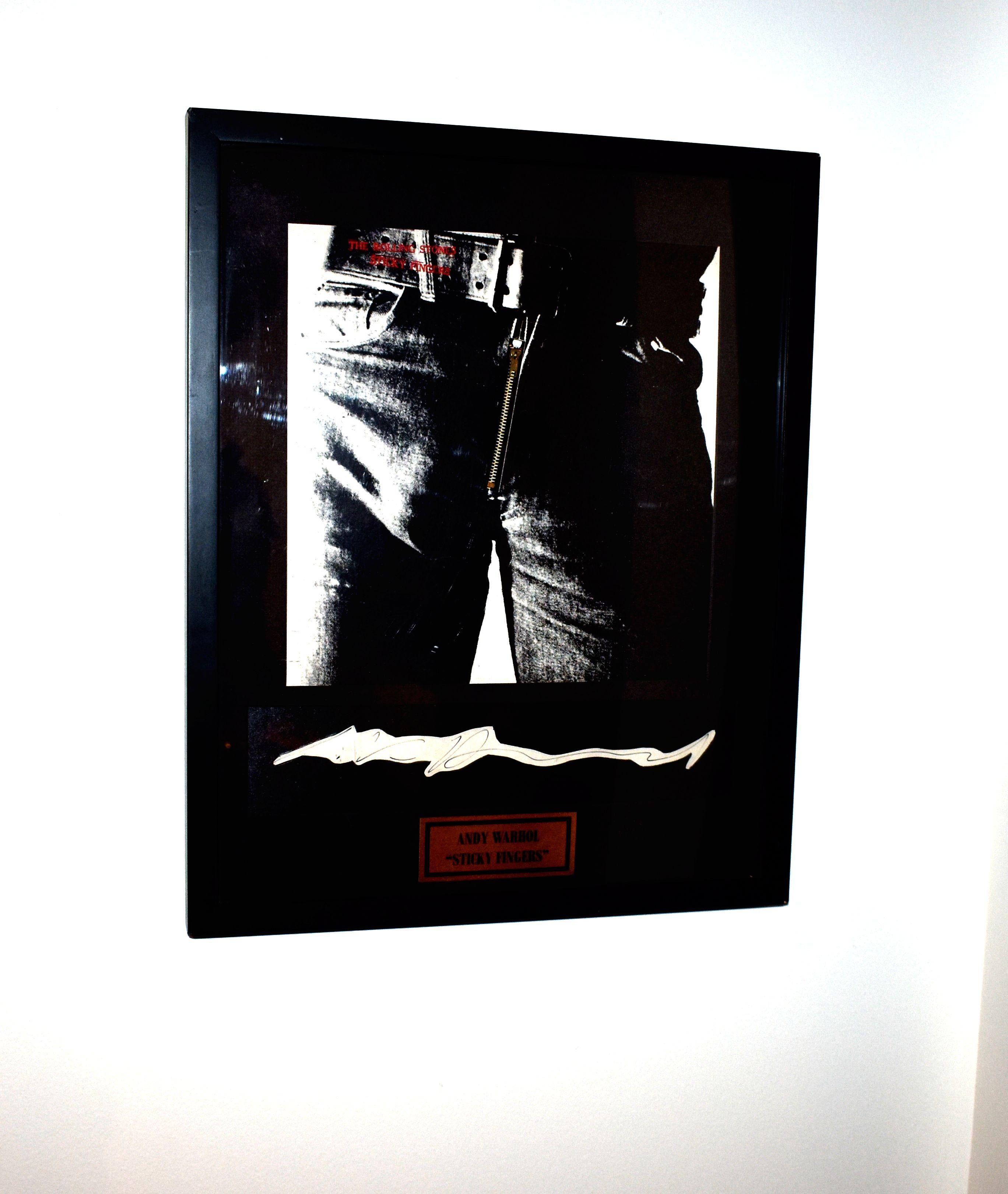 An original zipper copy of Sticky fingers signed by the pop-art legend Andy Warhol who was responsible for the album artwork. Mounted framed.
 Rolling stones 'sticky fingers' album and photographic album cover w/zipper designed by Andy Warhol