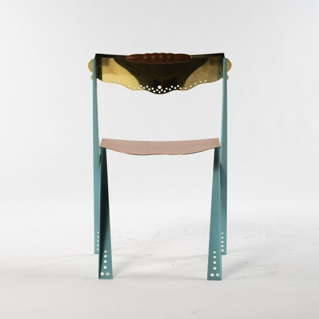 Chair 'Anebo Tak', 1987, H. 82 x 50.5 x 48 cm. Made by Borek Sipek for Driade, Milan. Sheet metal, painted turquoise, copper and brass, wooden handle. Marked: manufacturer's label., Irace, Driadebook, Milan 1995.

