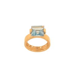 Bague en or rose avec topaze bleue