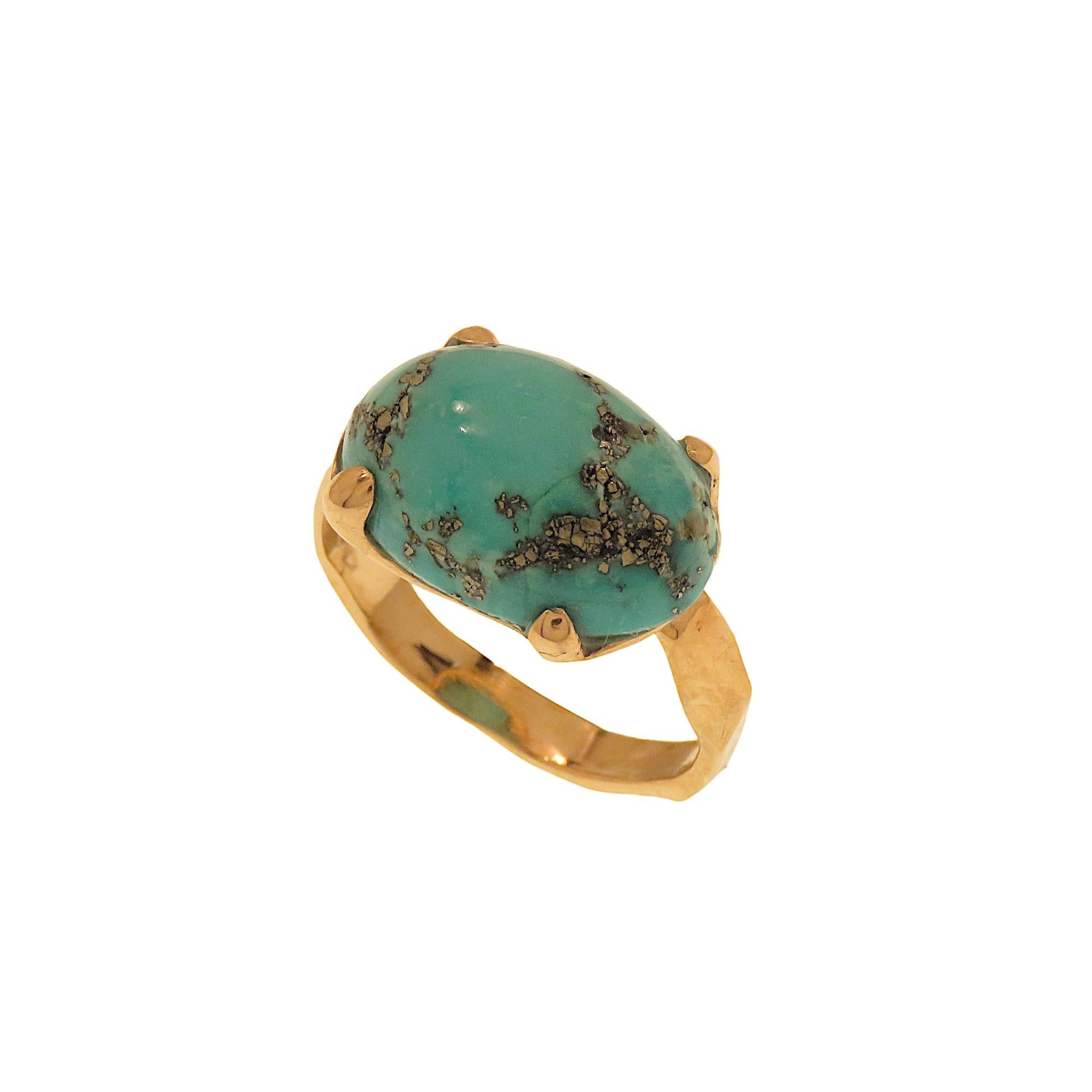 9K rose gold band ring with a cabochon-cut natural turquoise measuring 16x10 mm./0.629x0.393 and weighing 4.90 ct. The ring is handmade in our workshop in Milan Italy with a setting formed by a hammered wedding band and a 4-pronged griffe setting