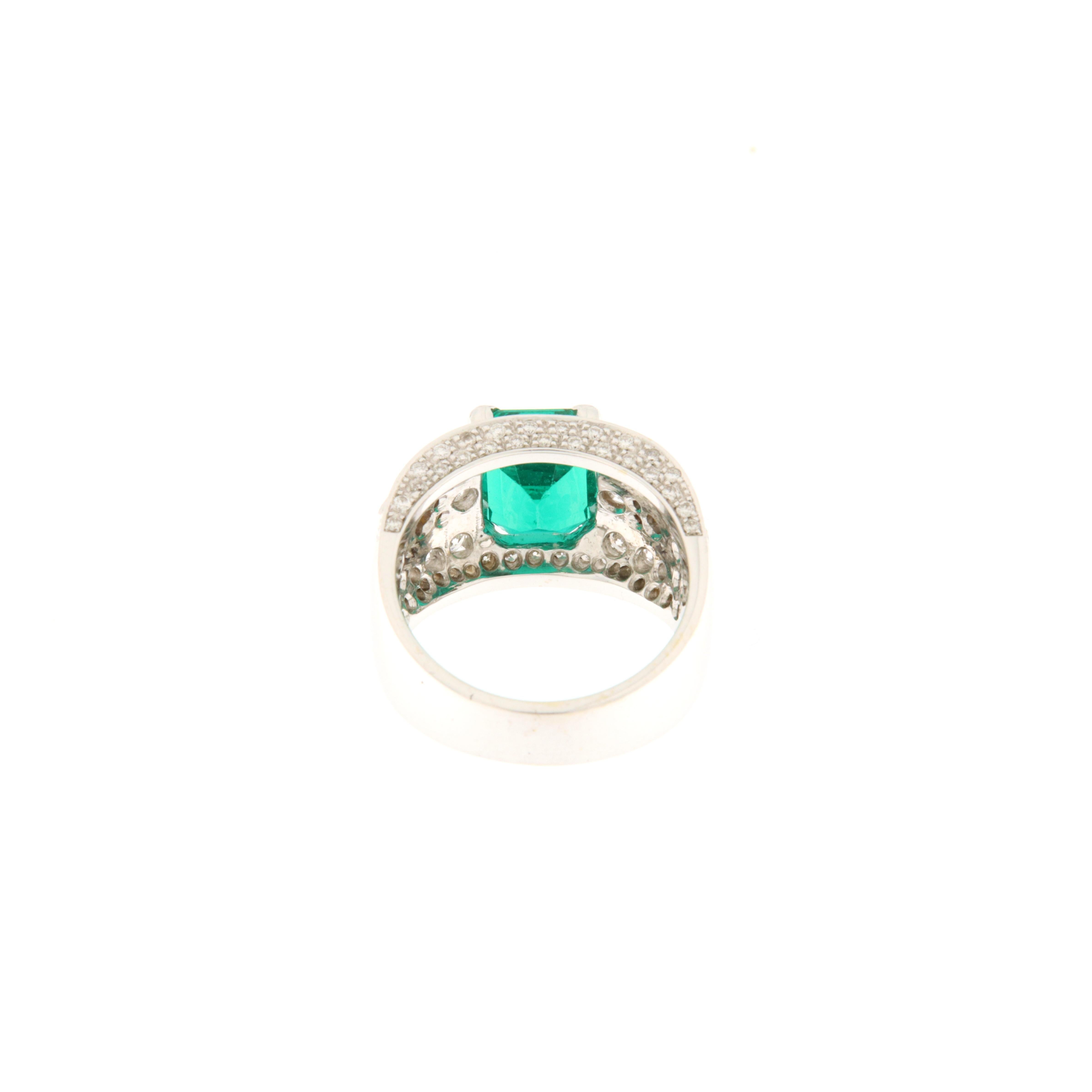 18 k white gold band ring with central emerald-cut emerald (ct.2.90) and diamonds on the band and profile (ct.1.54). Beautiful Italian manufacture. The ring is an easy-to-wear and impressive classic, suitable for even a small hand.